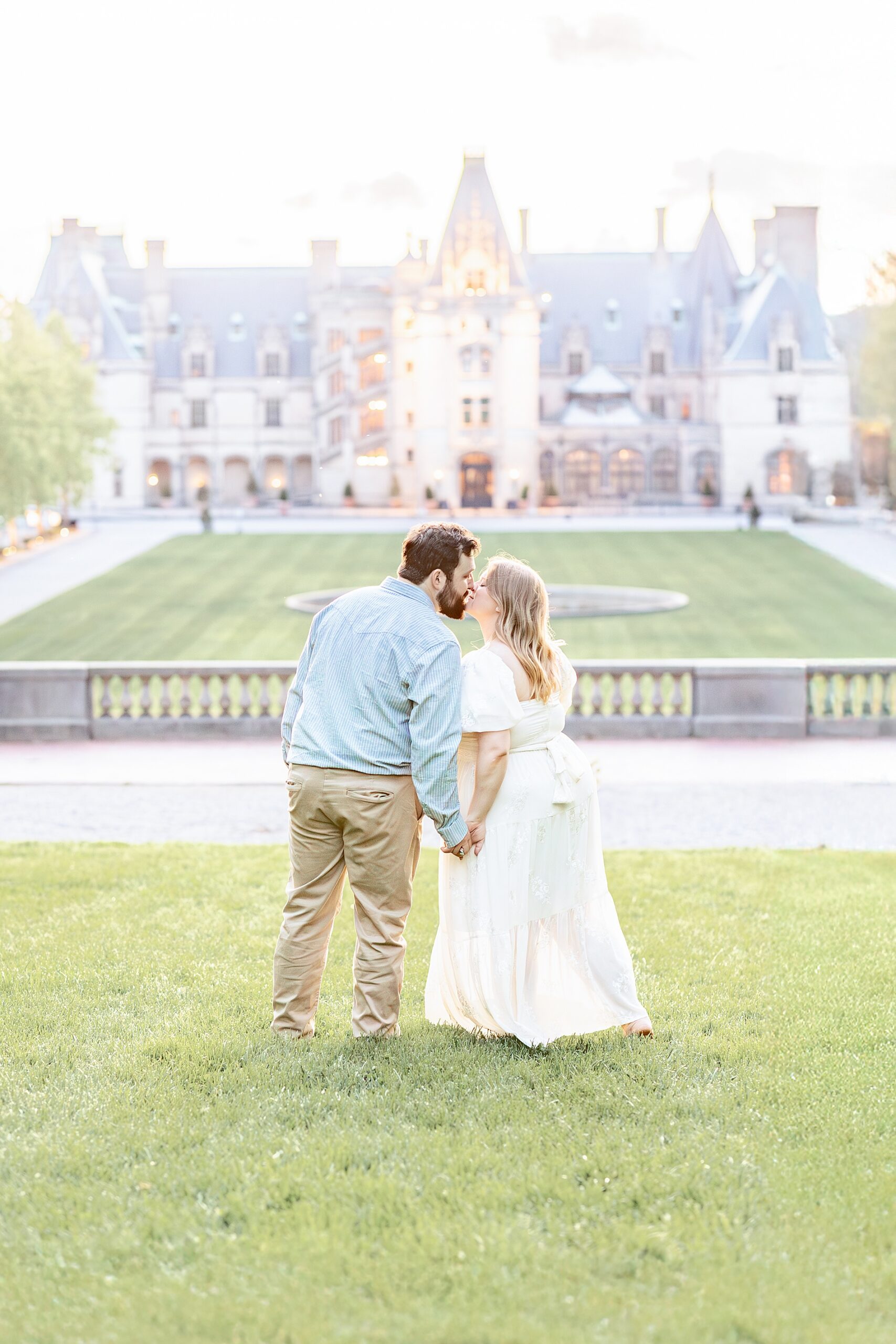 engaged couple kiss during Spring Biltmore Estate Engagement