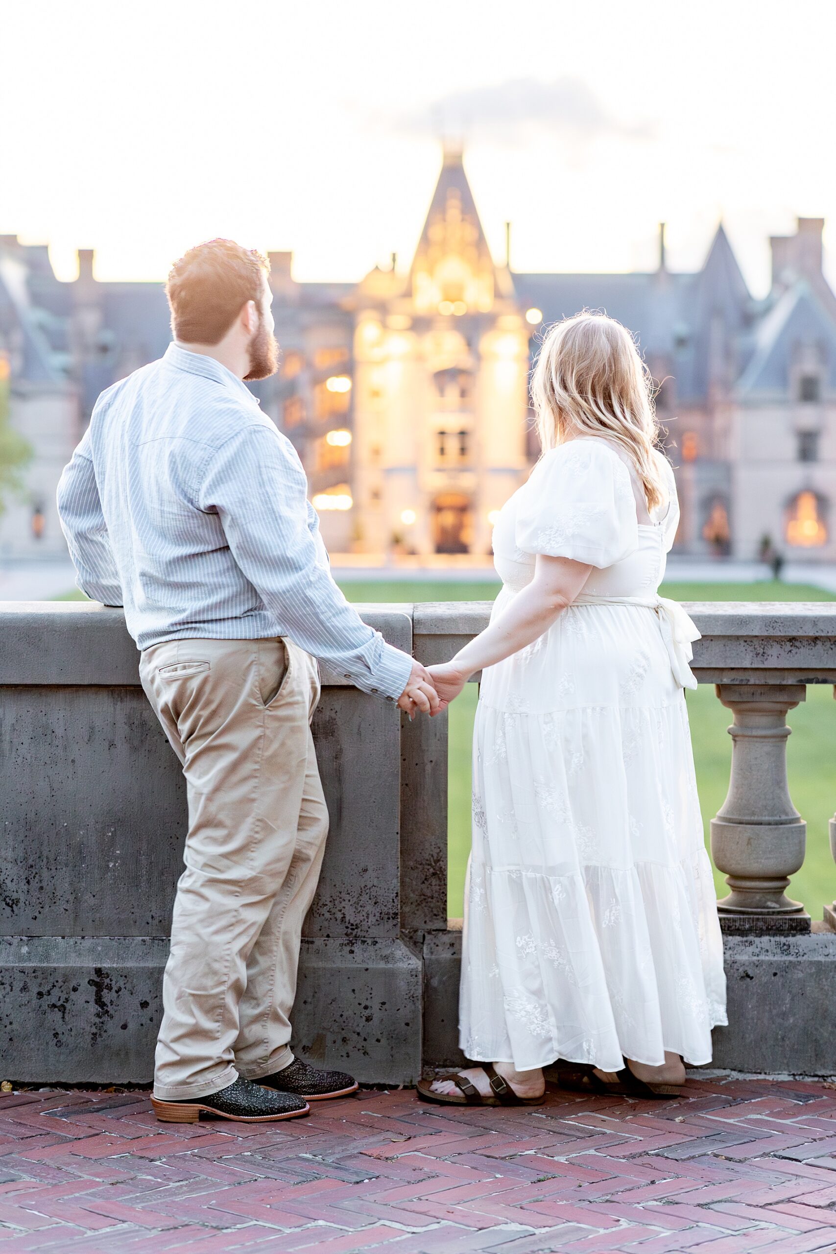 couple look out at Biltmore Estate