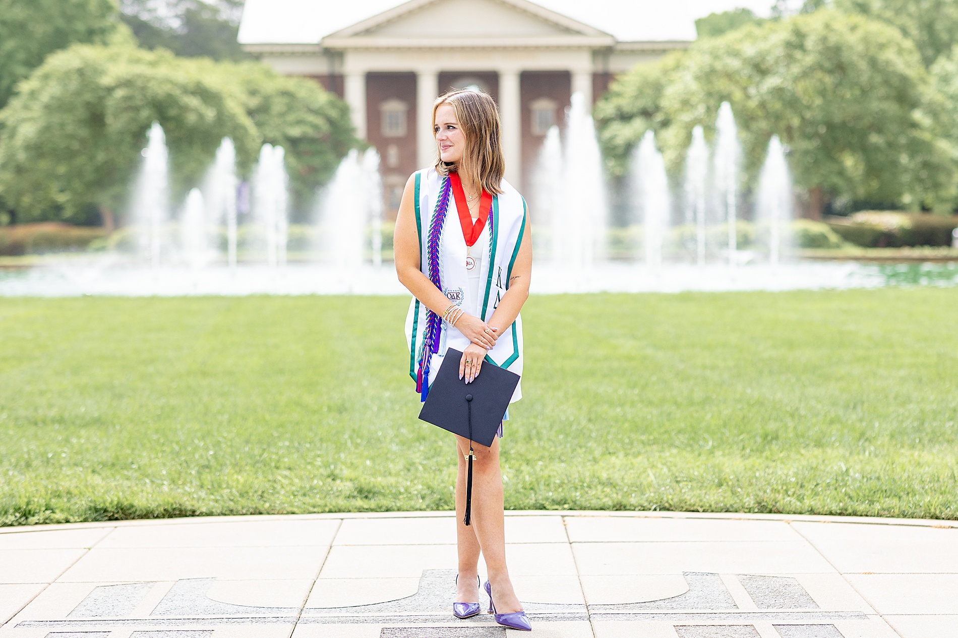 scenic senior portait in front of fountains at Furman University