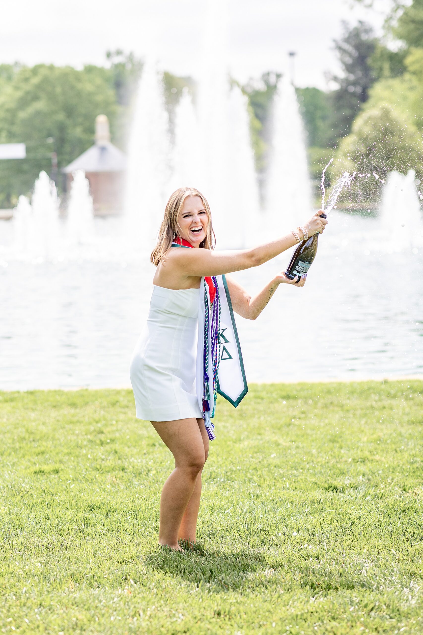 Furman University Graduate opens bottle of champagne
