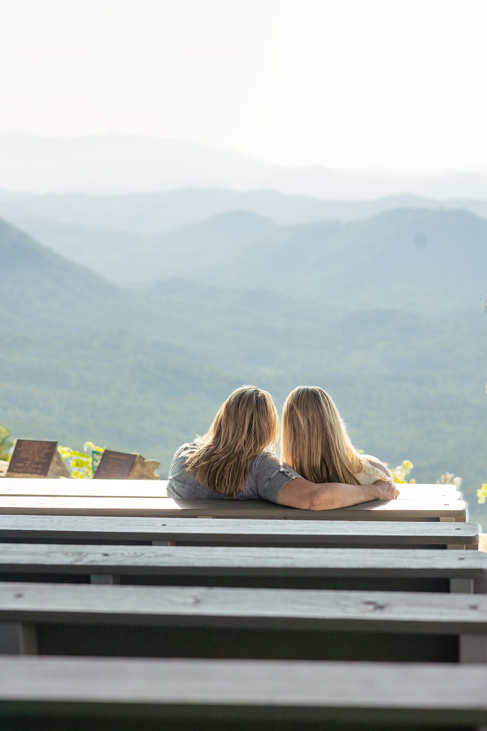senior girl and mom look at the Blue Ridge mountains