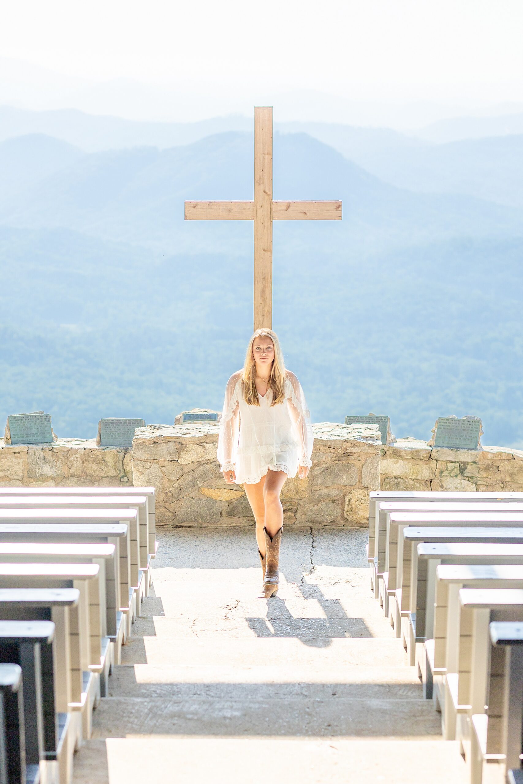 girl walks up aisle of outdoor chapel at Pretty Place Chapel