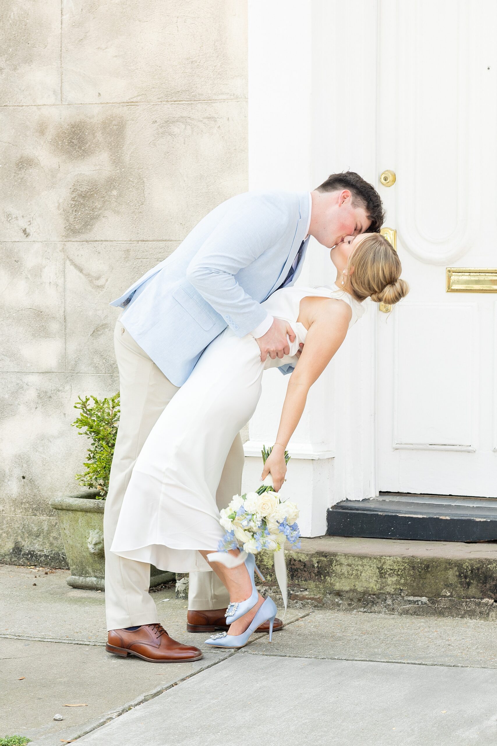 couple kiss during timeless engagement session