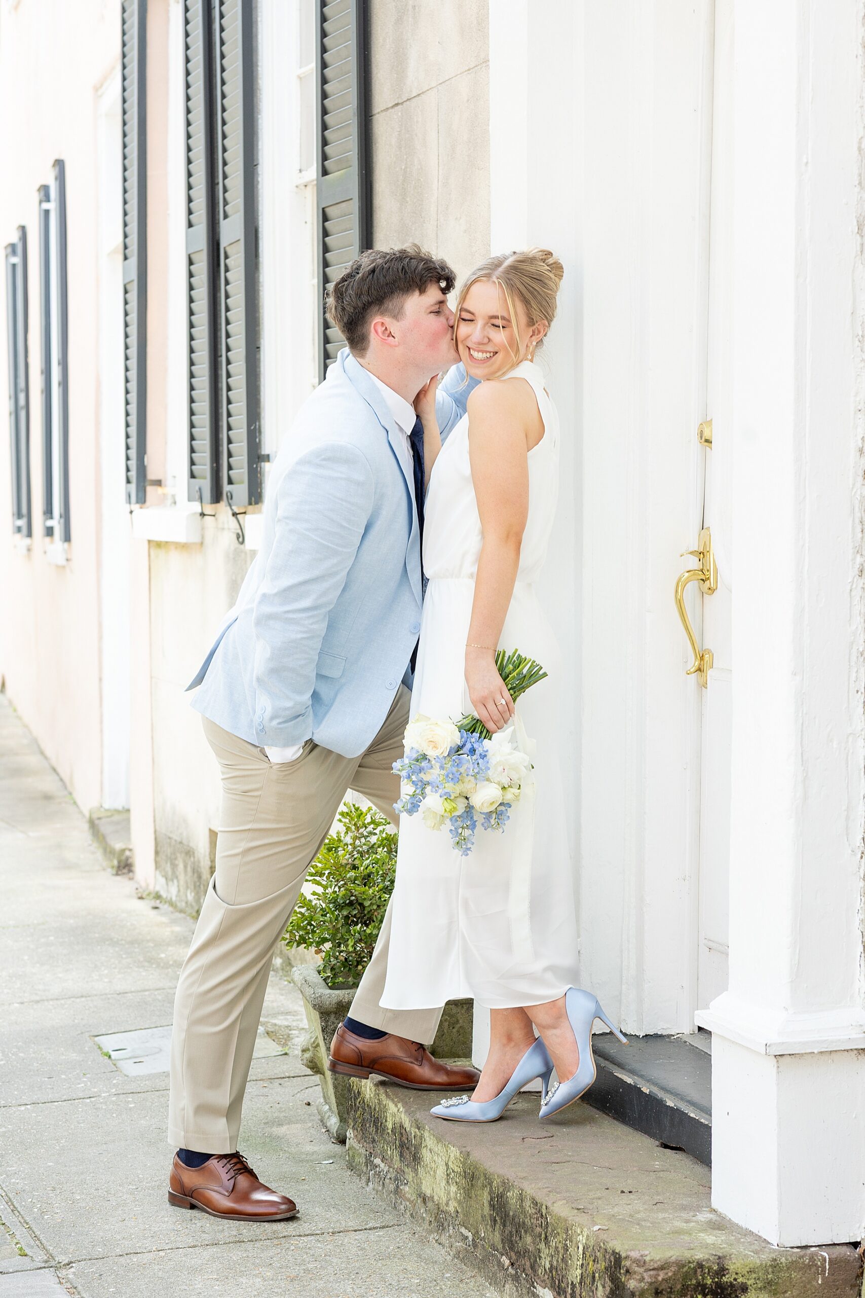 man kisses fiancé's cheek