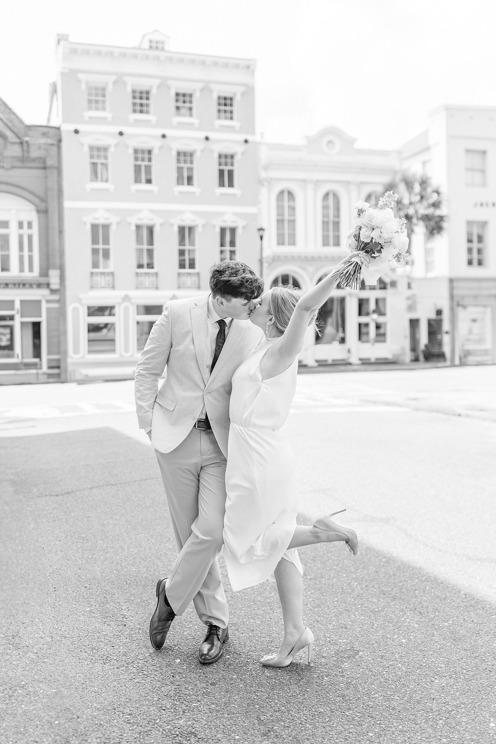 timeless engagement photos of couple kissing in the road