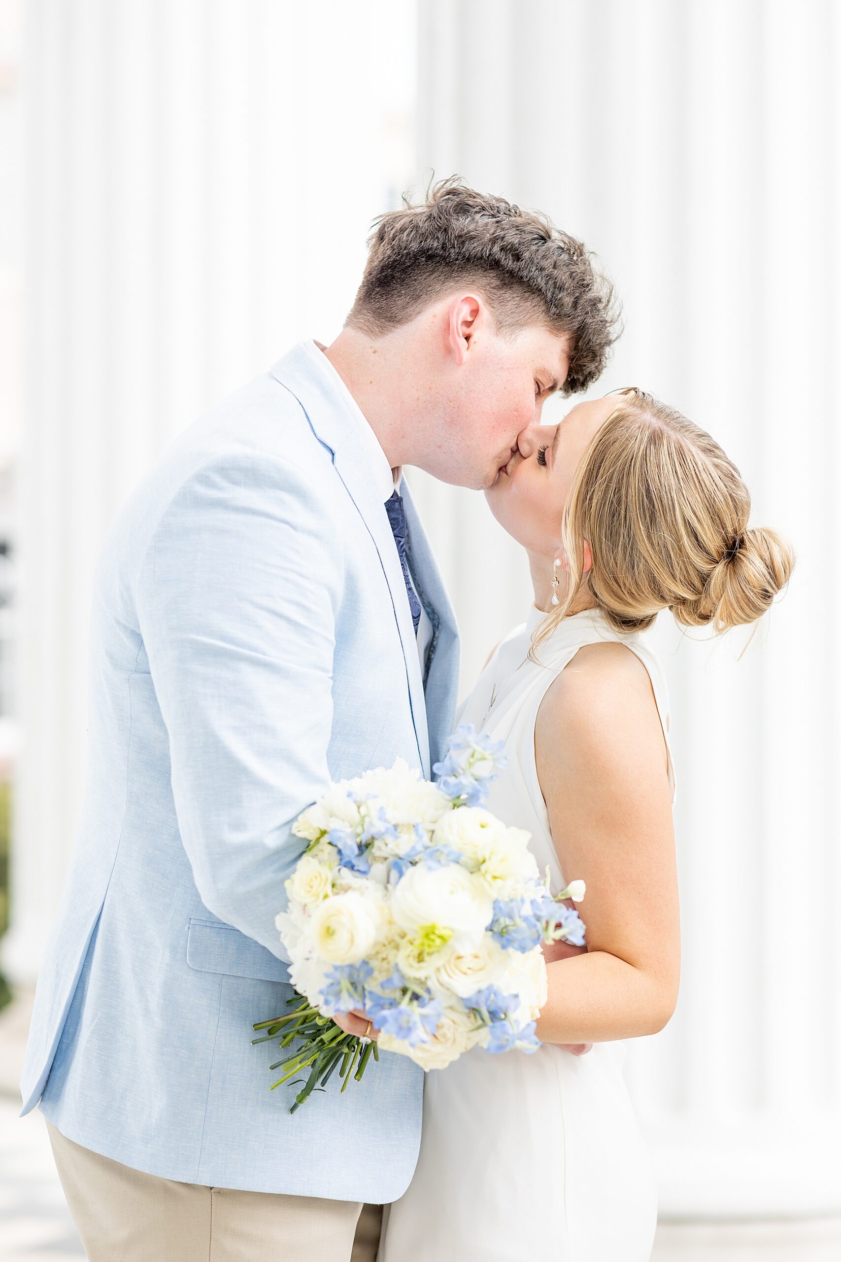 couple kiss during engagement session in Charleston