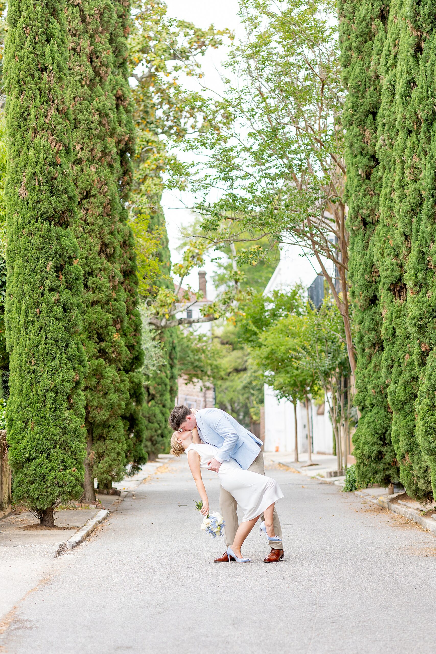 Romantic engagement photos of couple kissing in Charleston