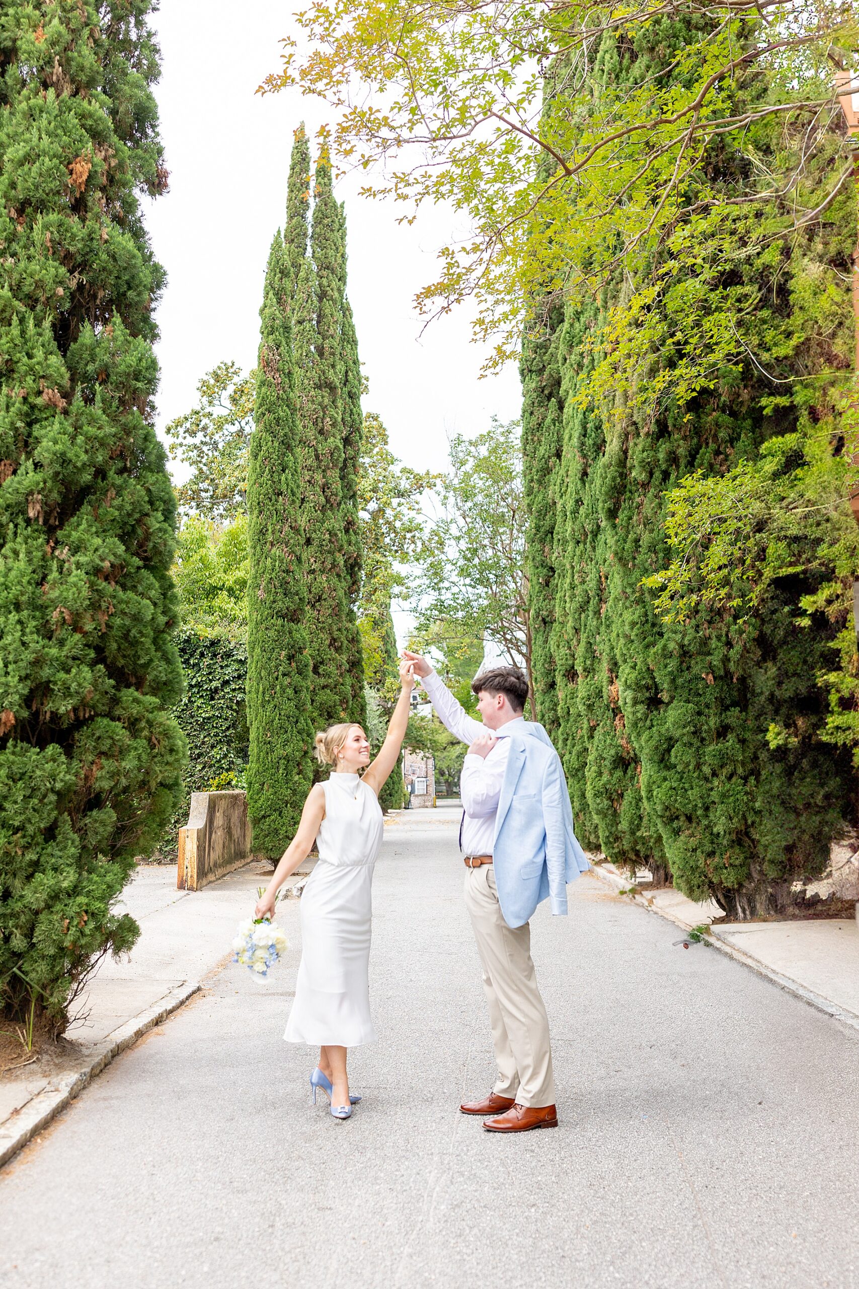 candid engagement photos of couple dancing