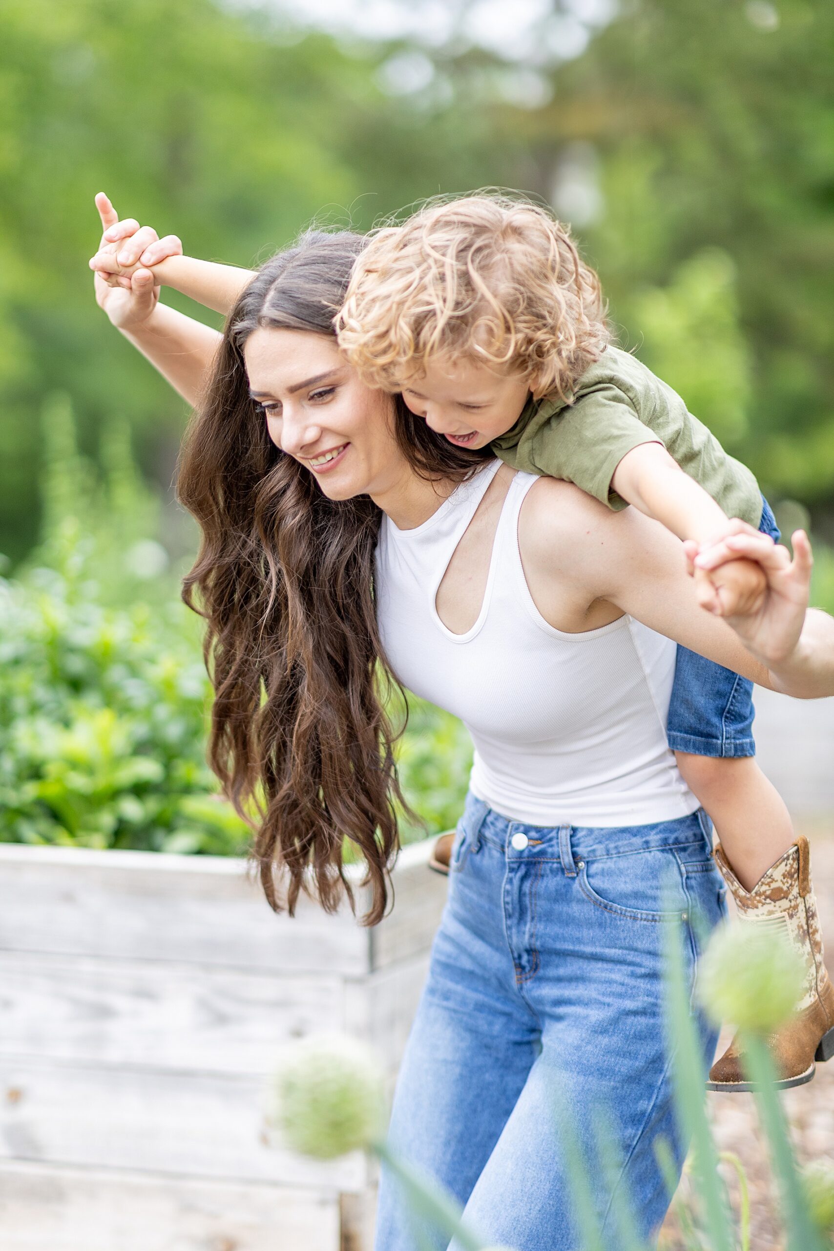 mom carries son on her back