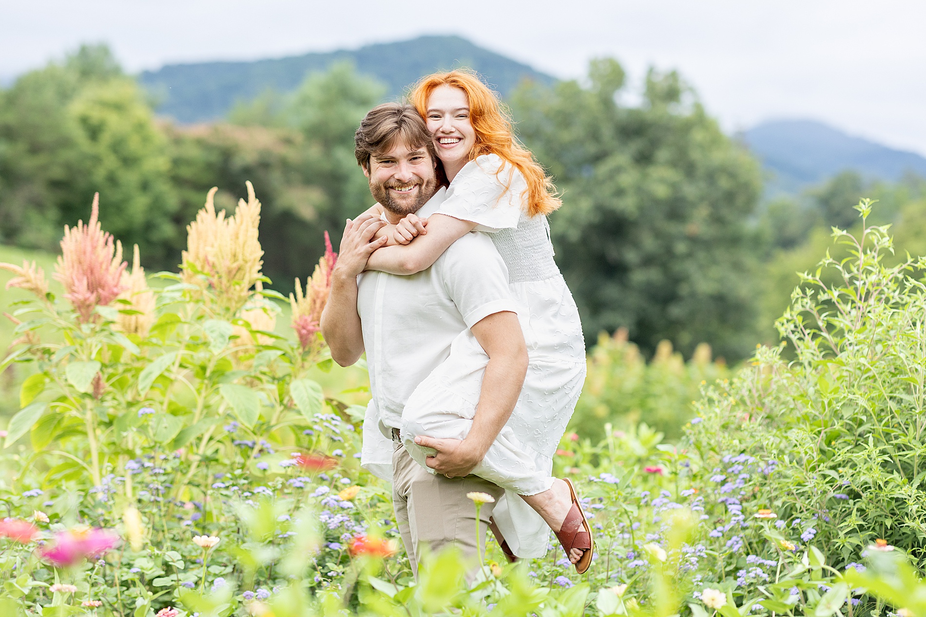guy carries his wife on his back