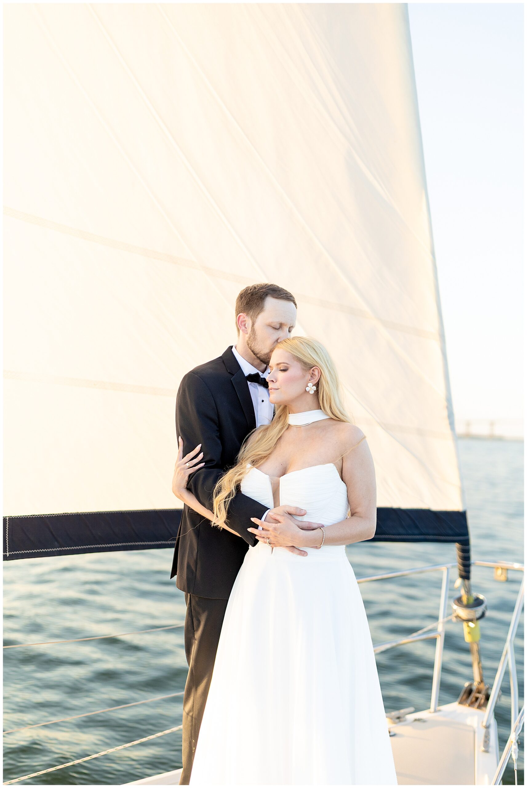 Romantic Charleston Harbor Wedding Portraits on a Sailboat