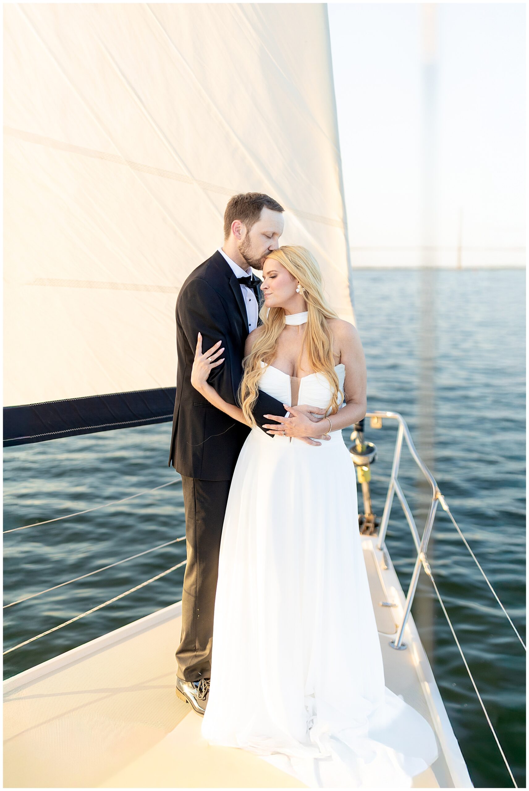 Charleston Harbor Wedding Portraits on a Sailboat by Charleston wedding photographer 