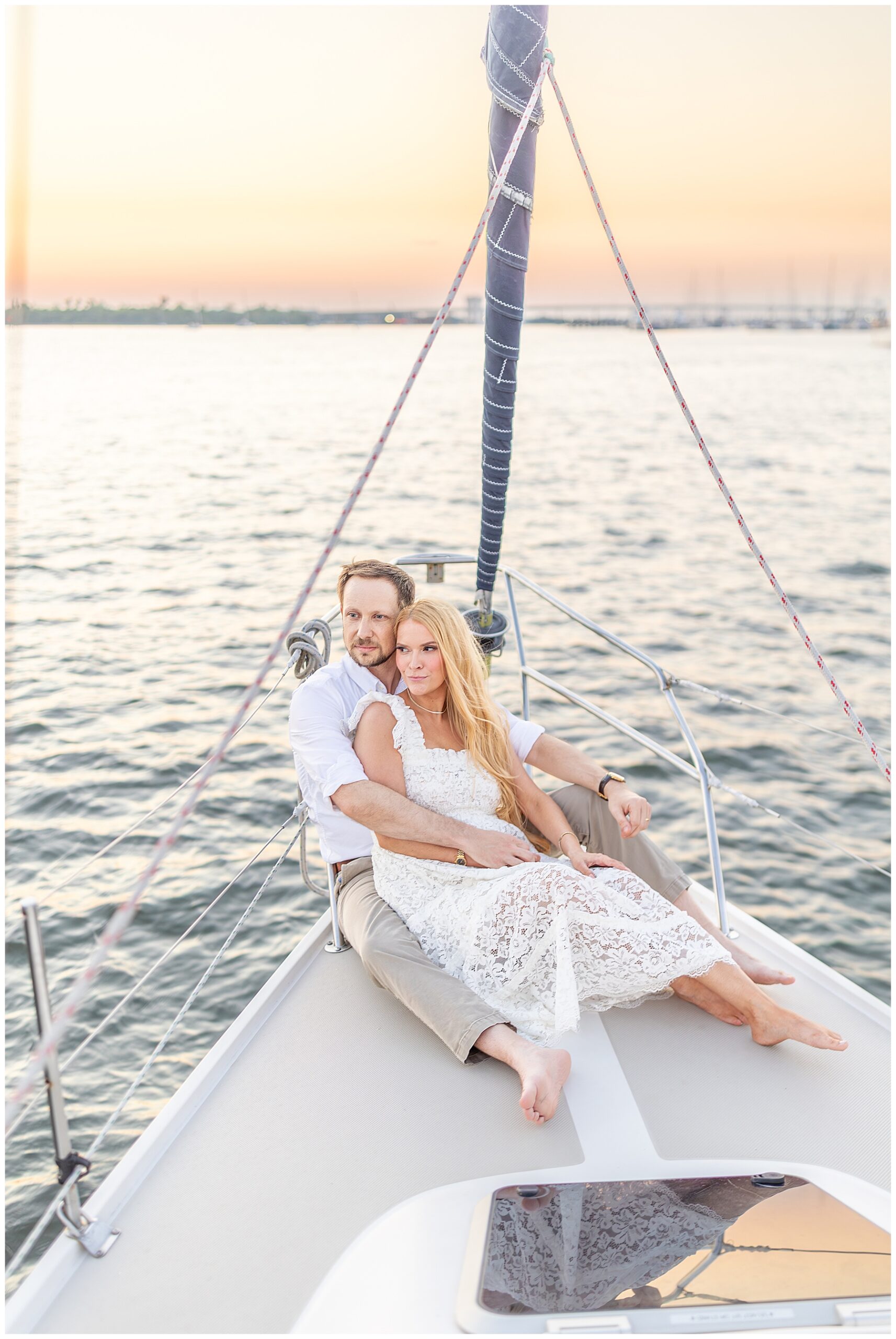 Charleston wedding photographer captures couple's wedding photos on sailboat in Charleston Harbor