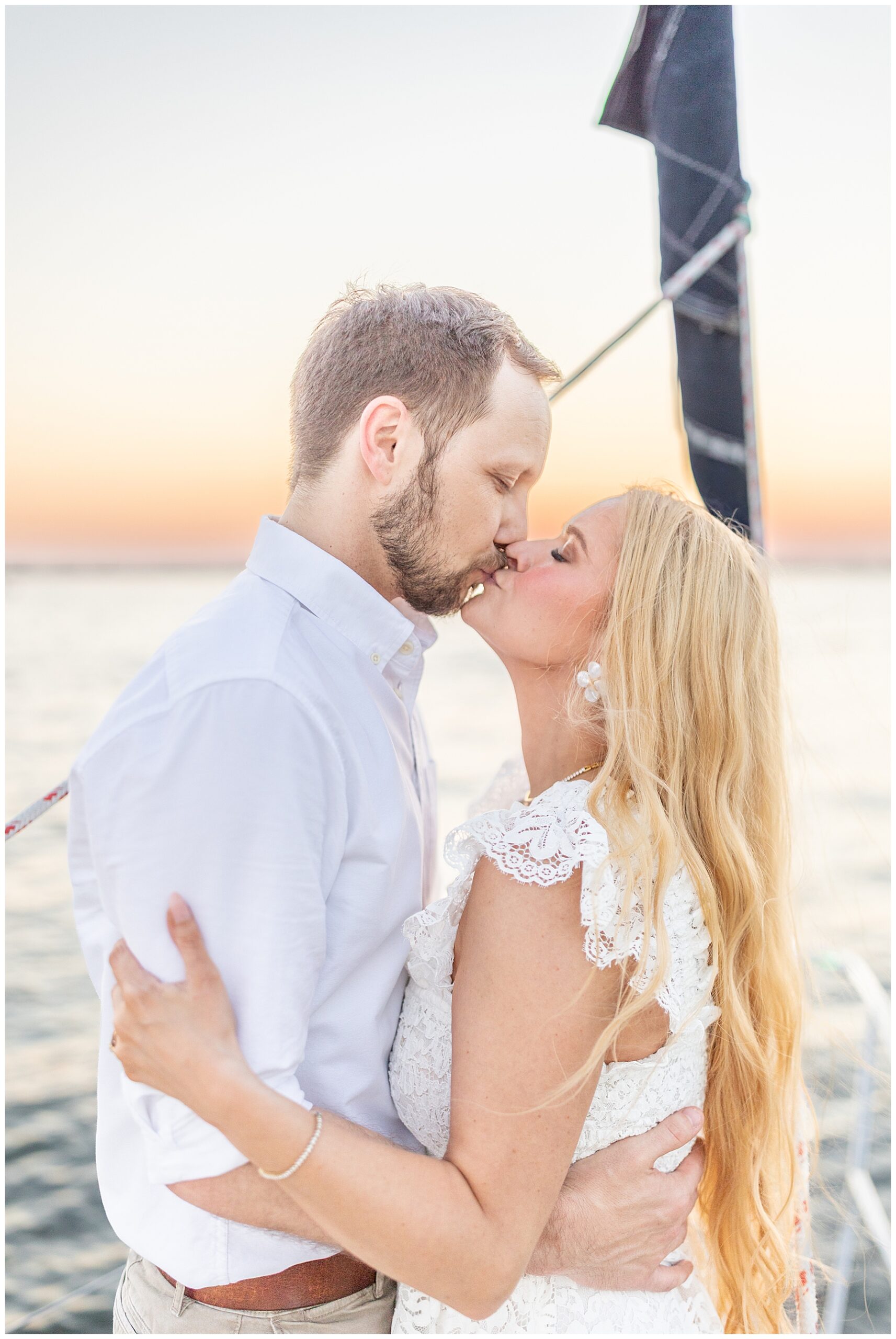 wedding photos on a sailboat at sunset at Charleston Harbor  