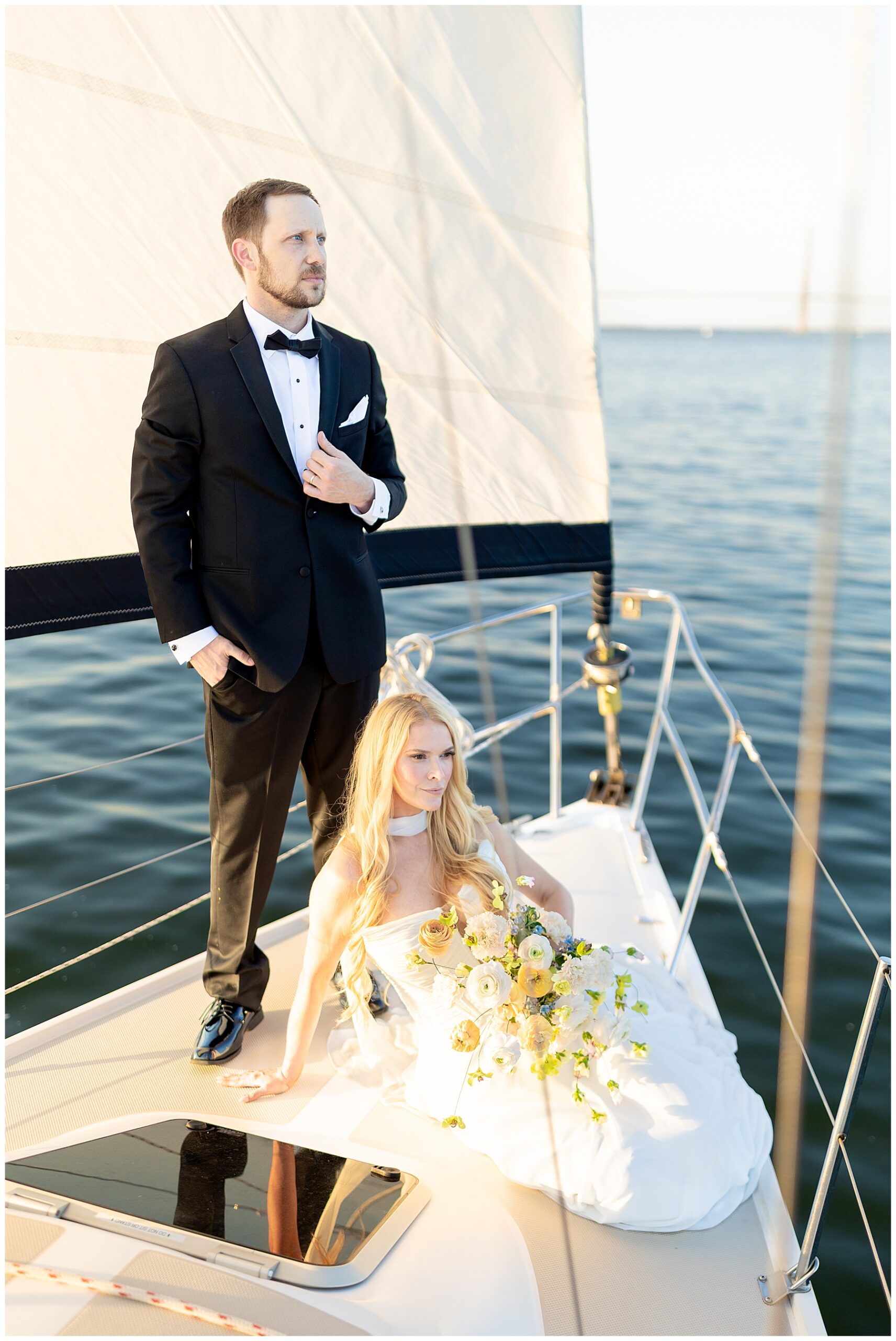 Romantic Charleston Harbor Wedding Portraits on a Sailboat by Charleston wedding photographer 