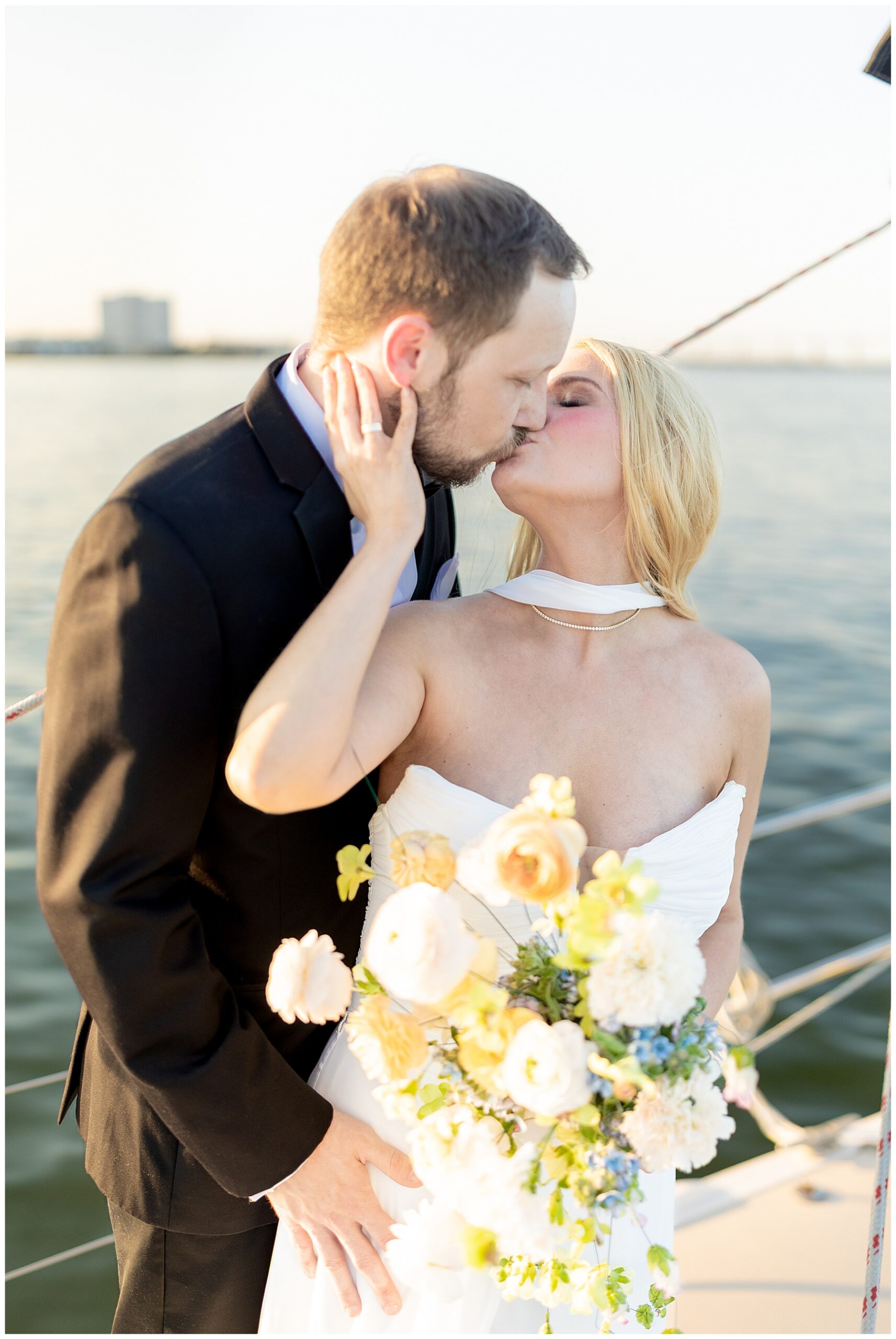 Charleston Harbor Wedding Portraits on a Sailboat by Charleston wedding photographer 
