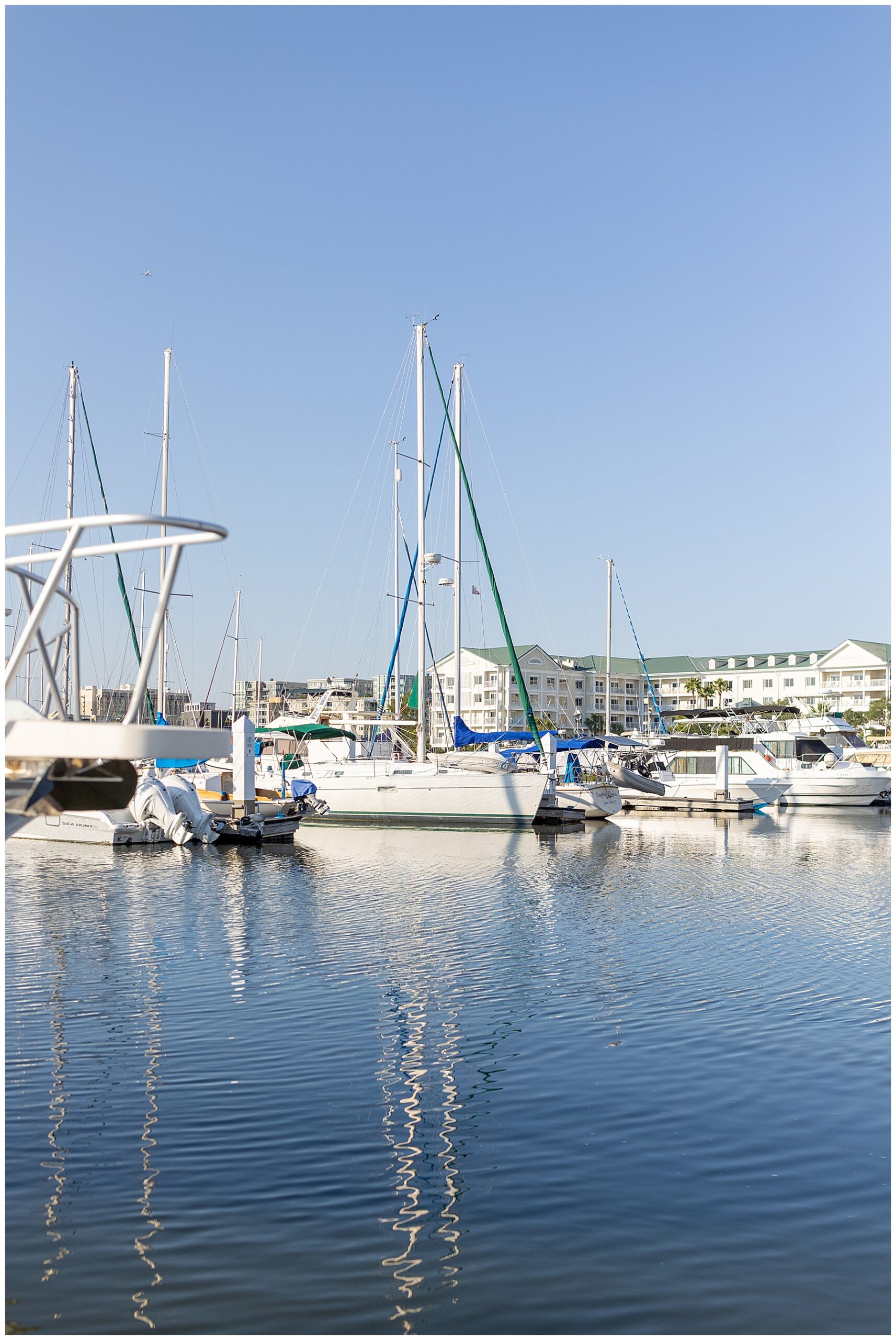 Charleston Harbor Wedding portraits on sailboat by Charleston Wedding Photographer 