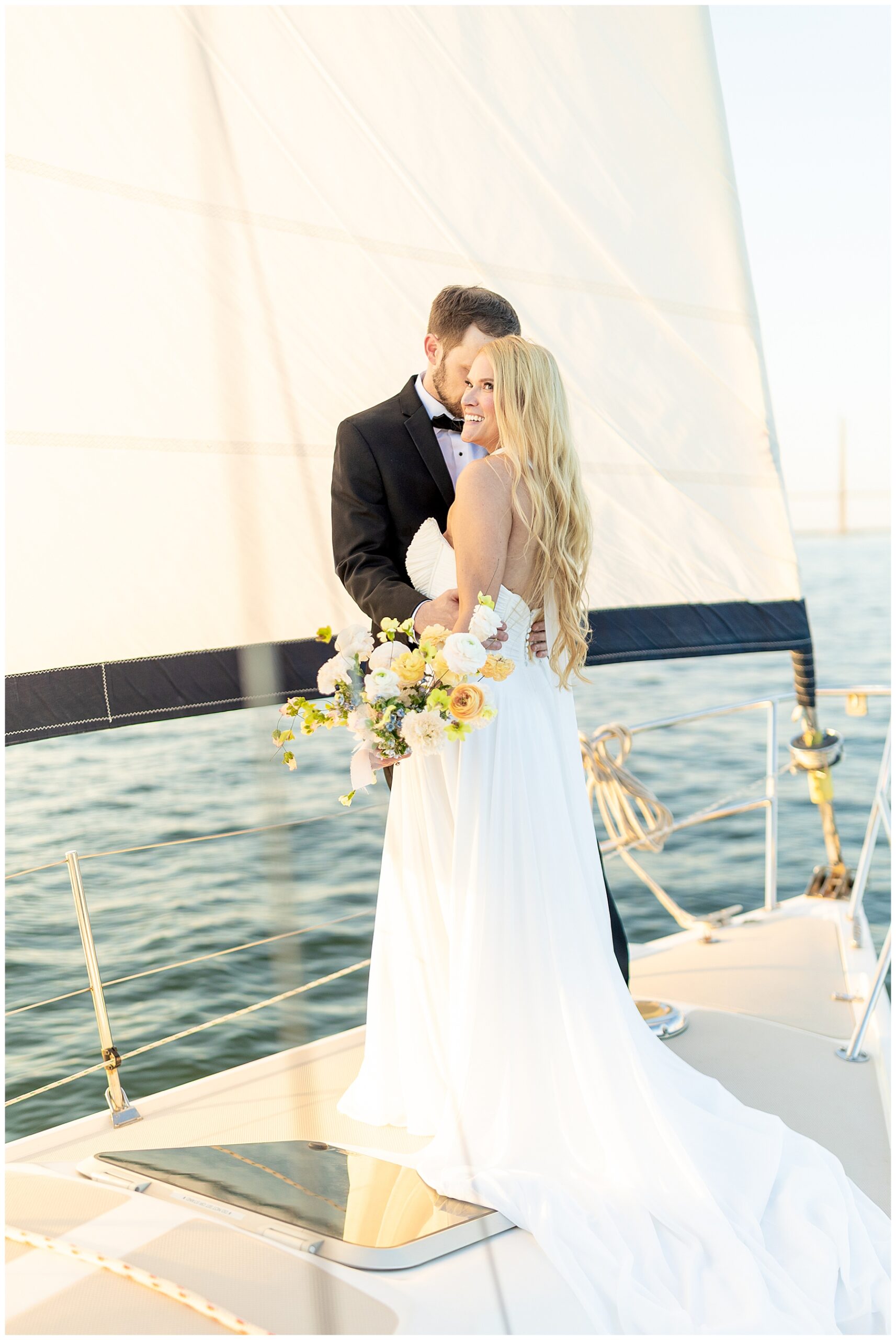 newlyweds on a sailboat in Charleston 