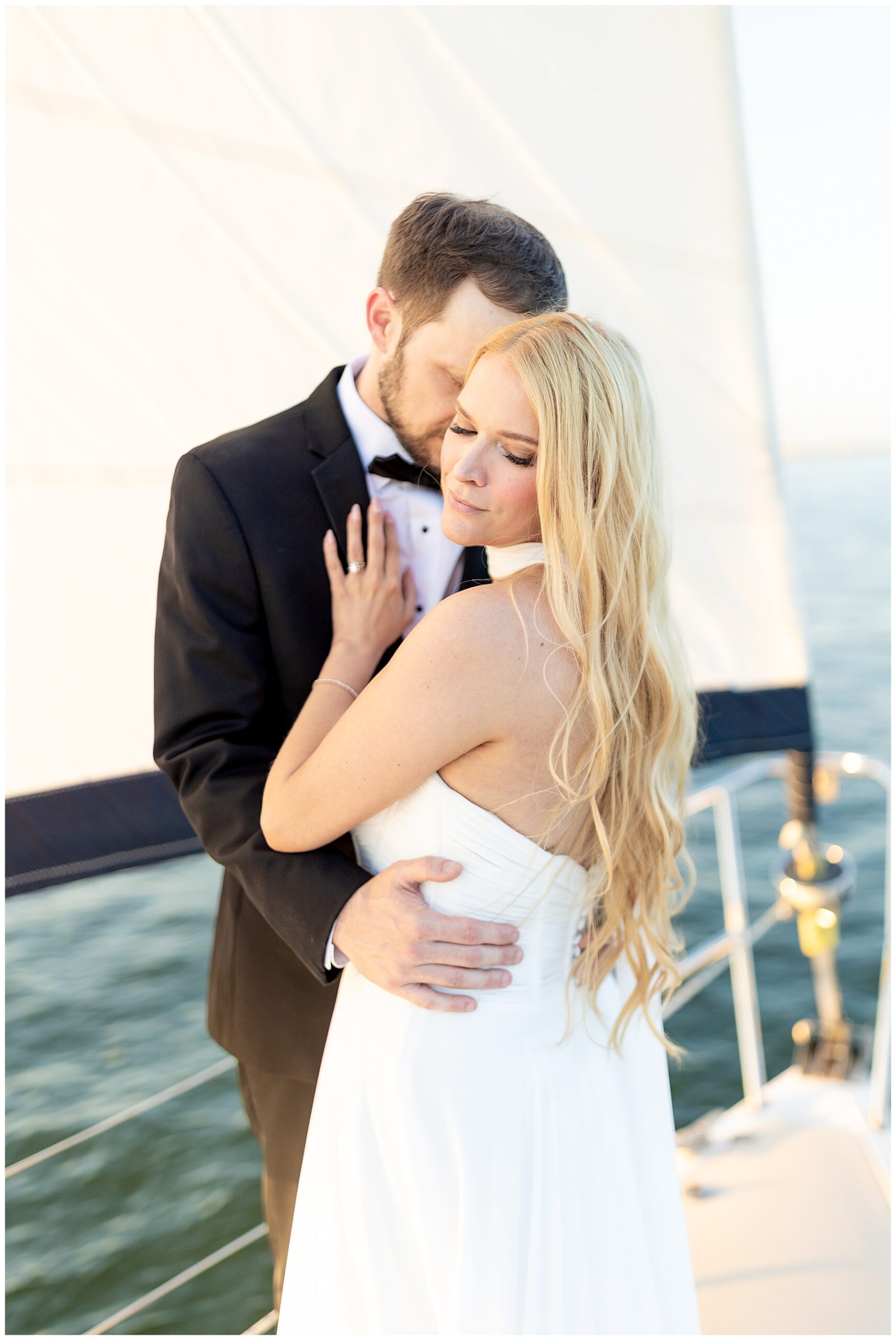 Charleston Harbor Wedding Portraits on a Sailboat by Charleston wedding photographer 