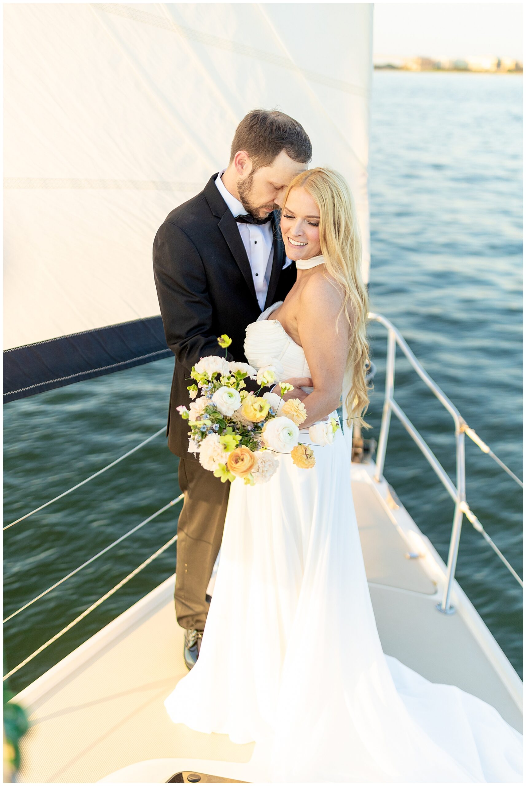 Charleston Harbor Wedding Portraits on a Sailboat by Charleston wedding photographer 