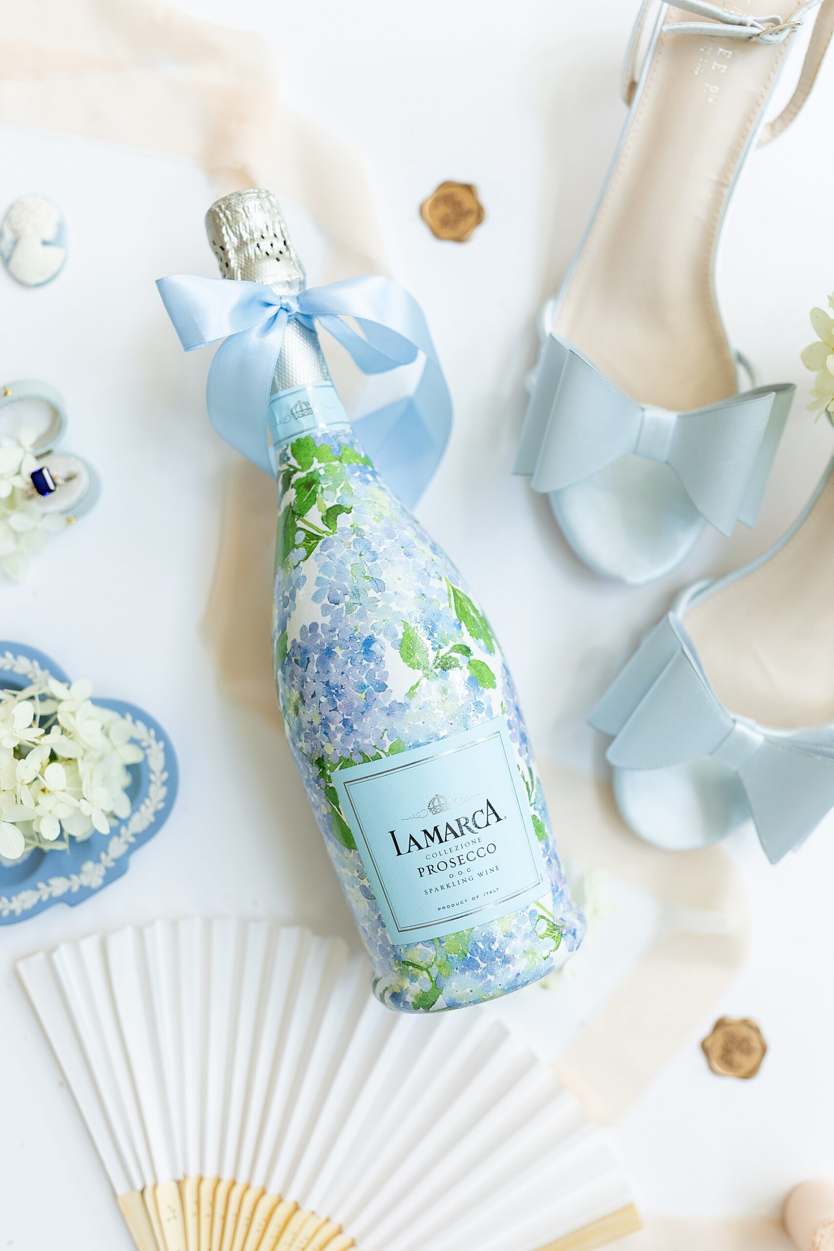 custom champagne bottle in blue hyrdangea flowers