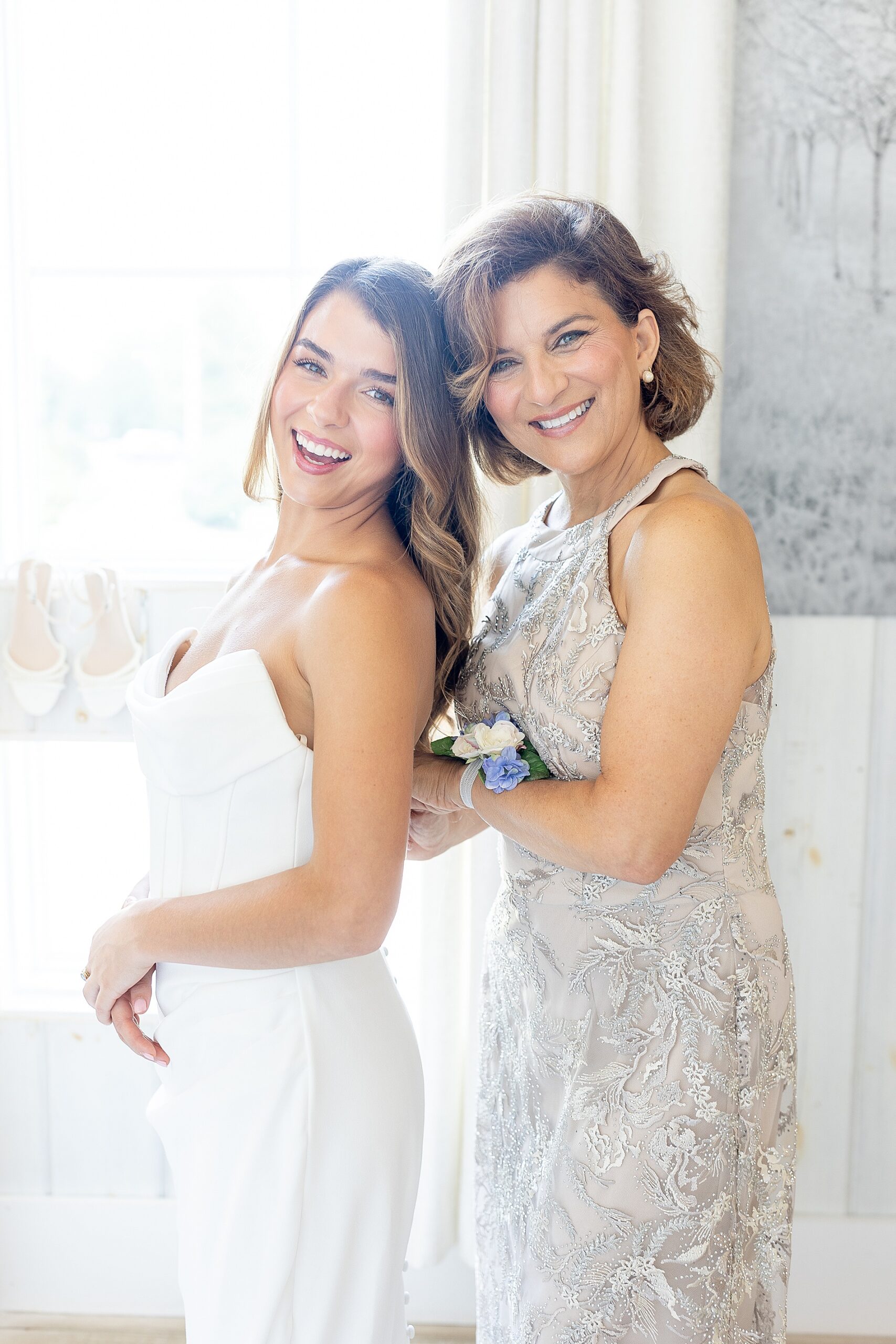 bride getting into wedding dress