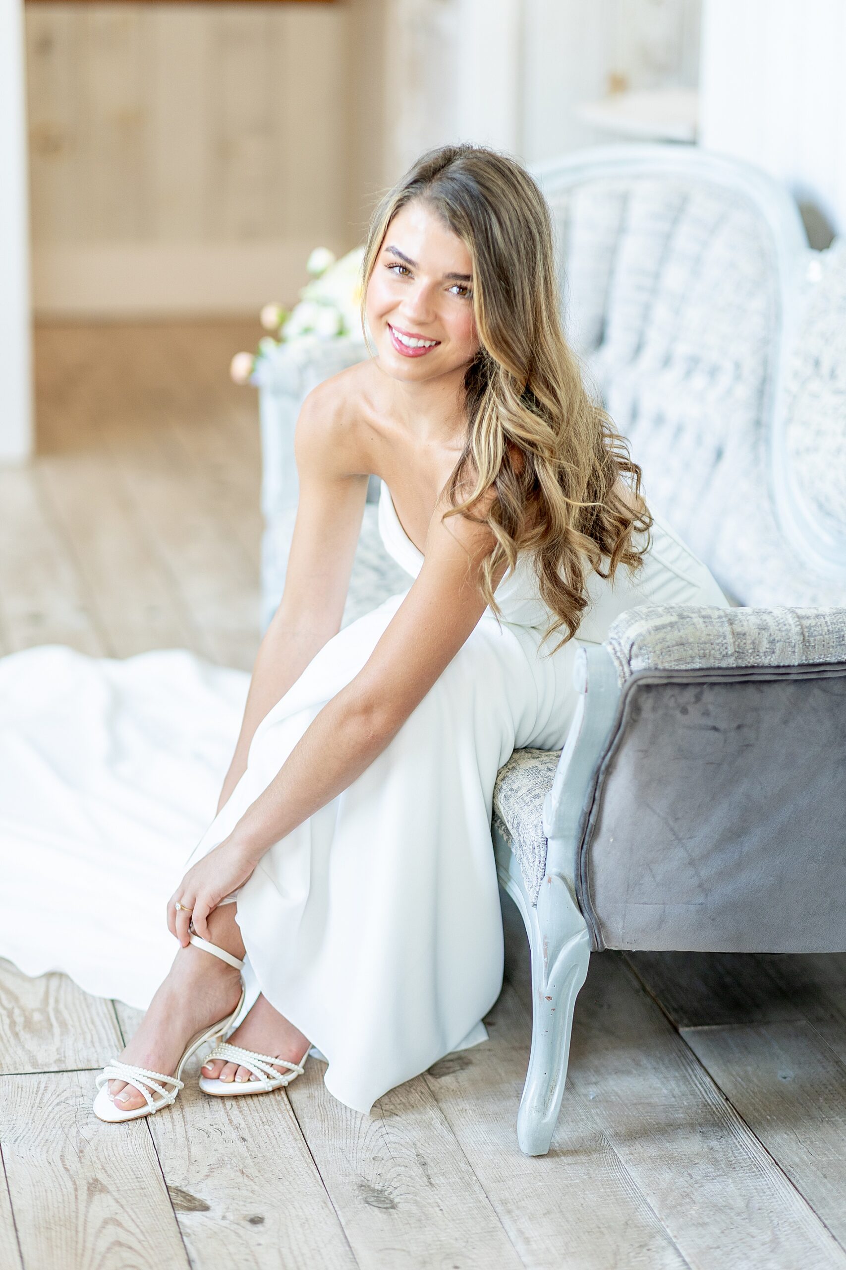 BRide putting wedding shoes on