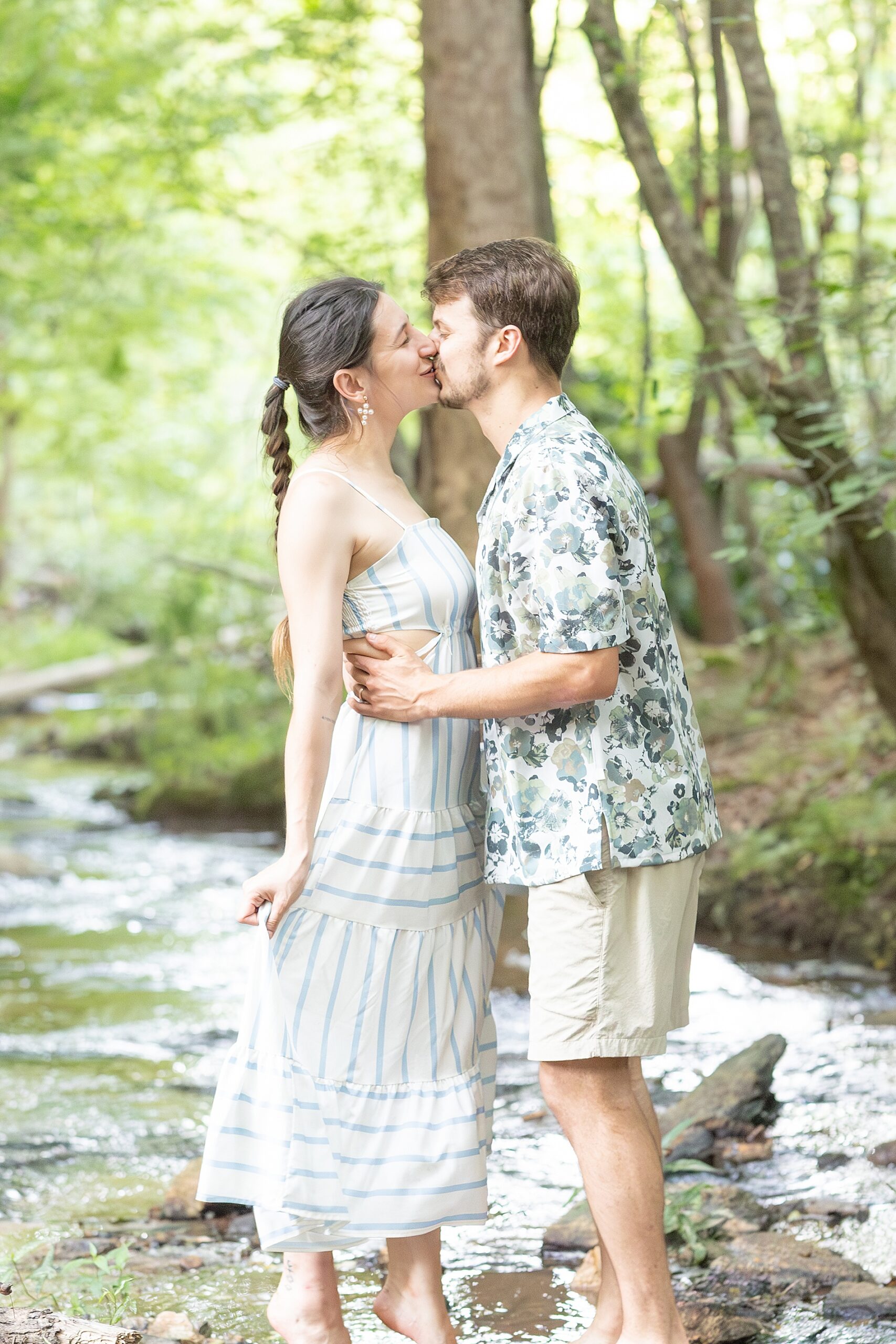 couple kiss during lifestyle session on family property