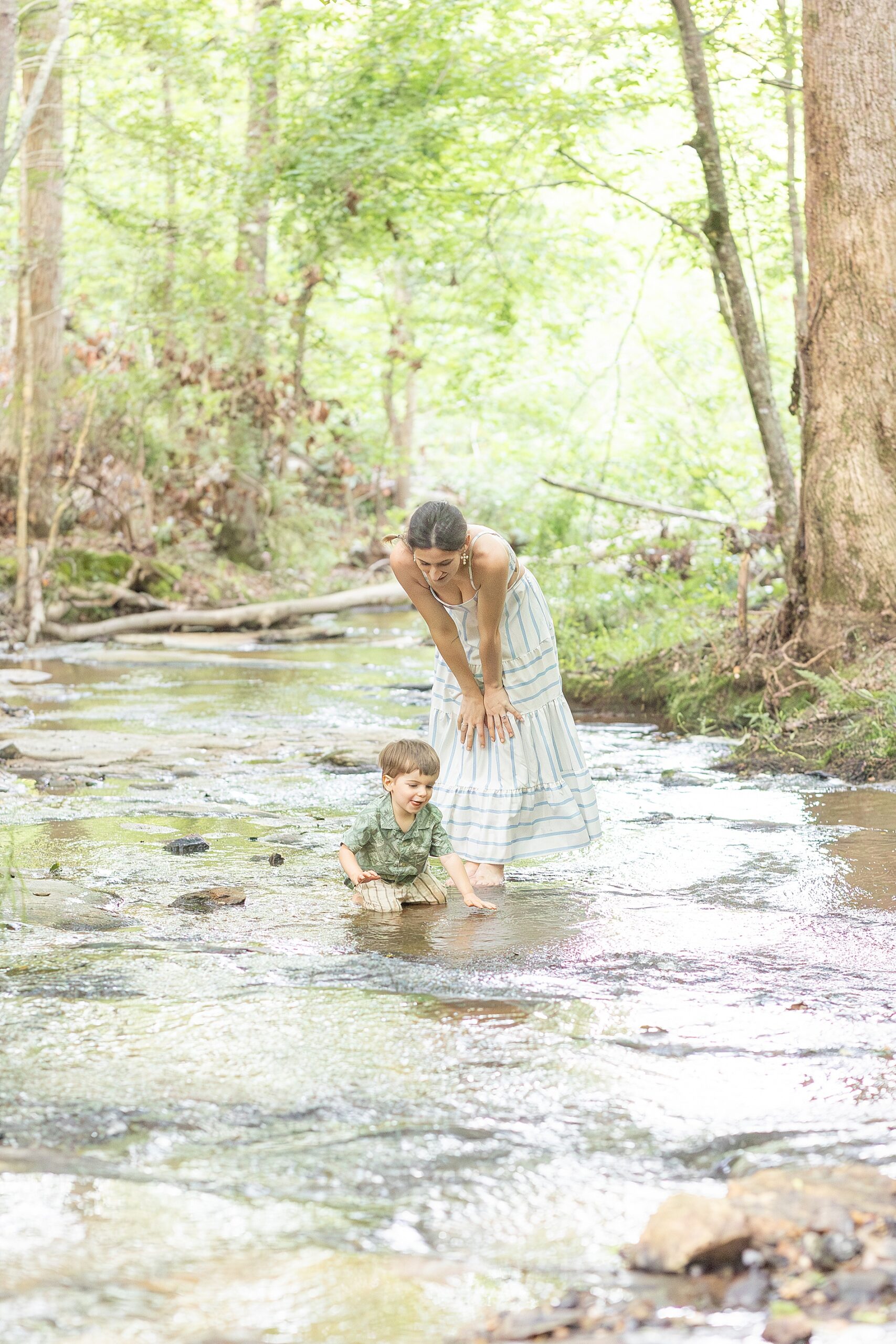 family portraits playing in creek on family property in Greenville, SC
