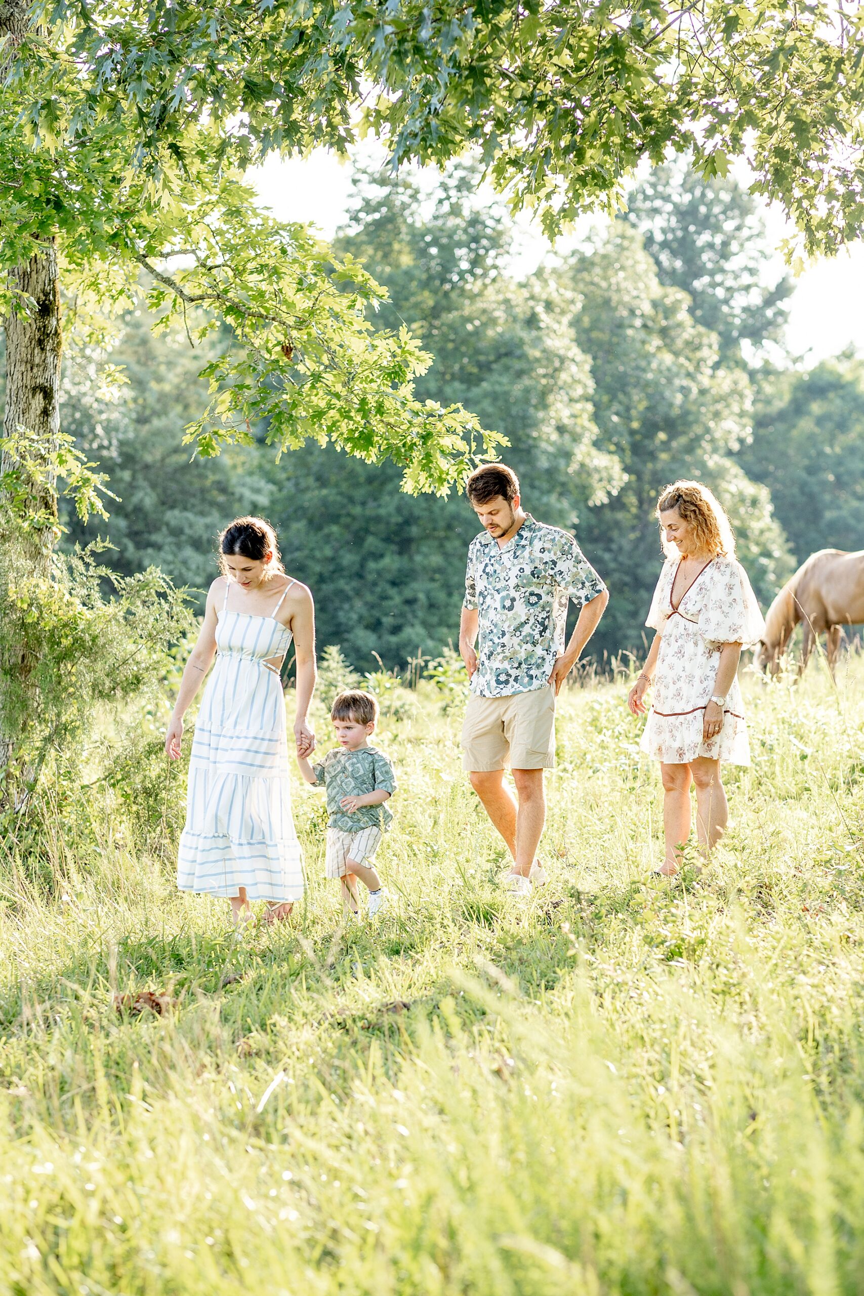 family walks together on family property during Greenville, SC Outdoor Lifestyle Session