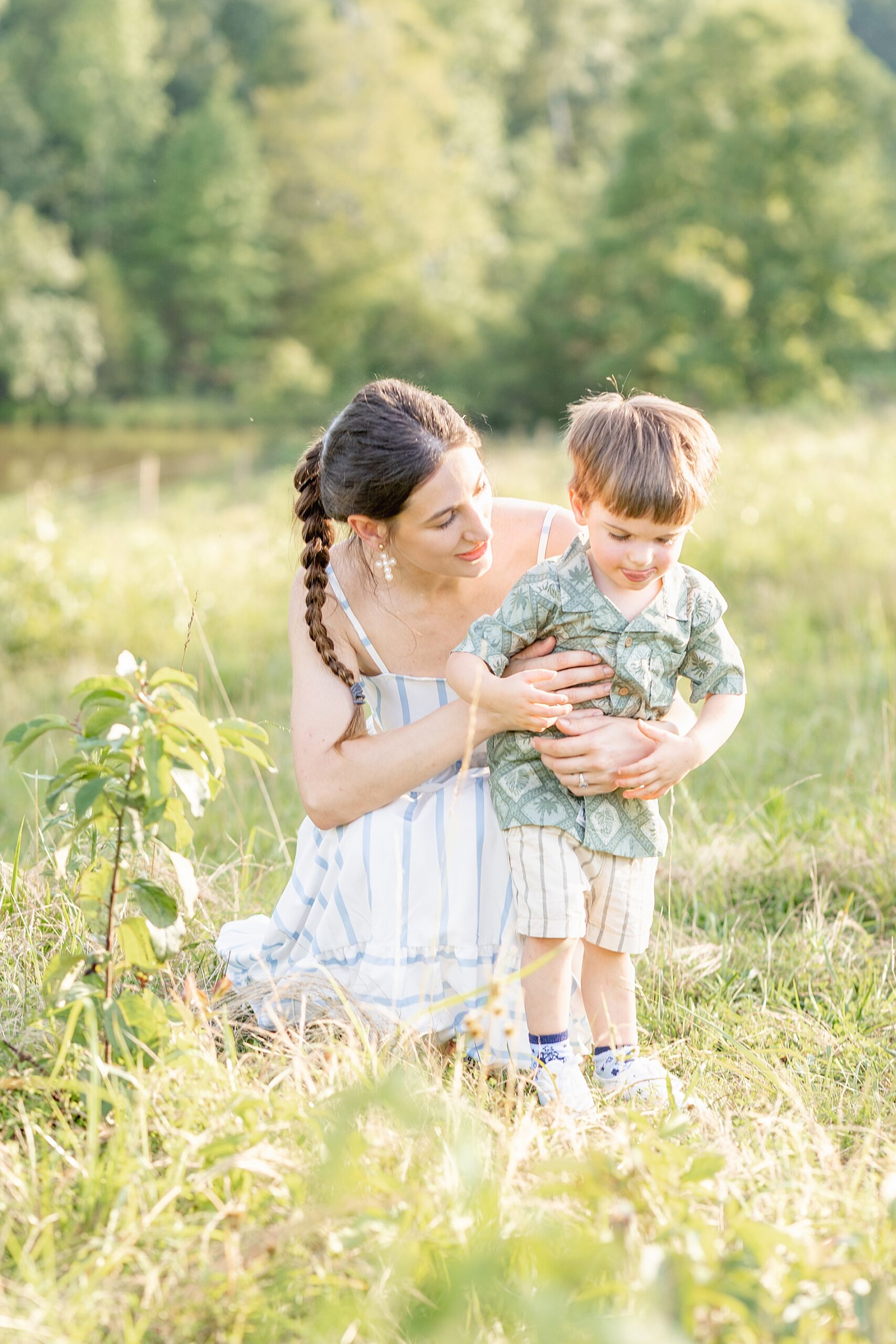 mom kneels down with her son