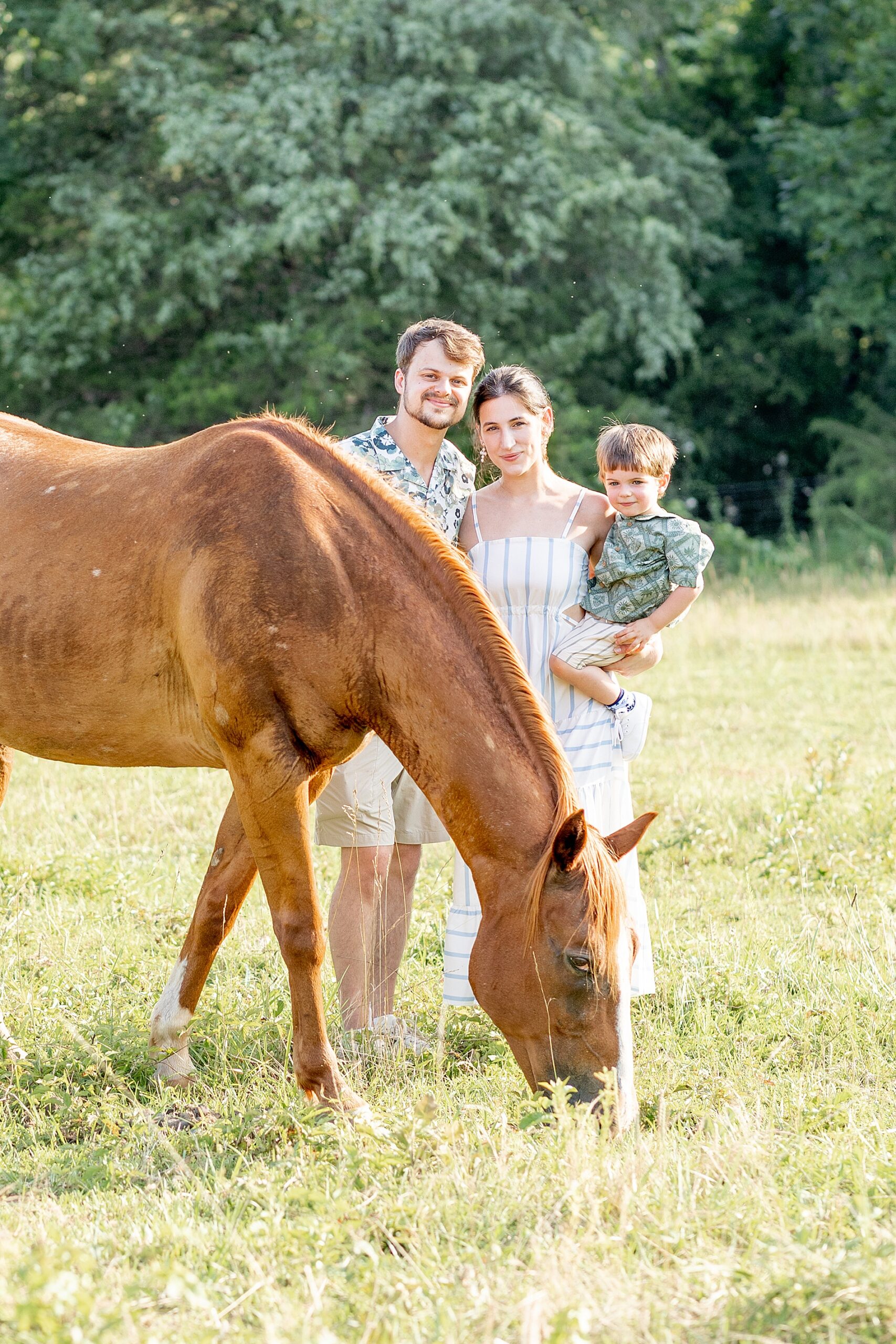 family of three with their horse