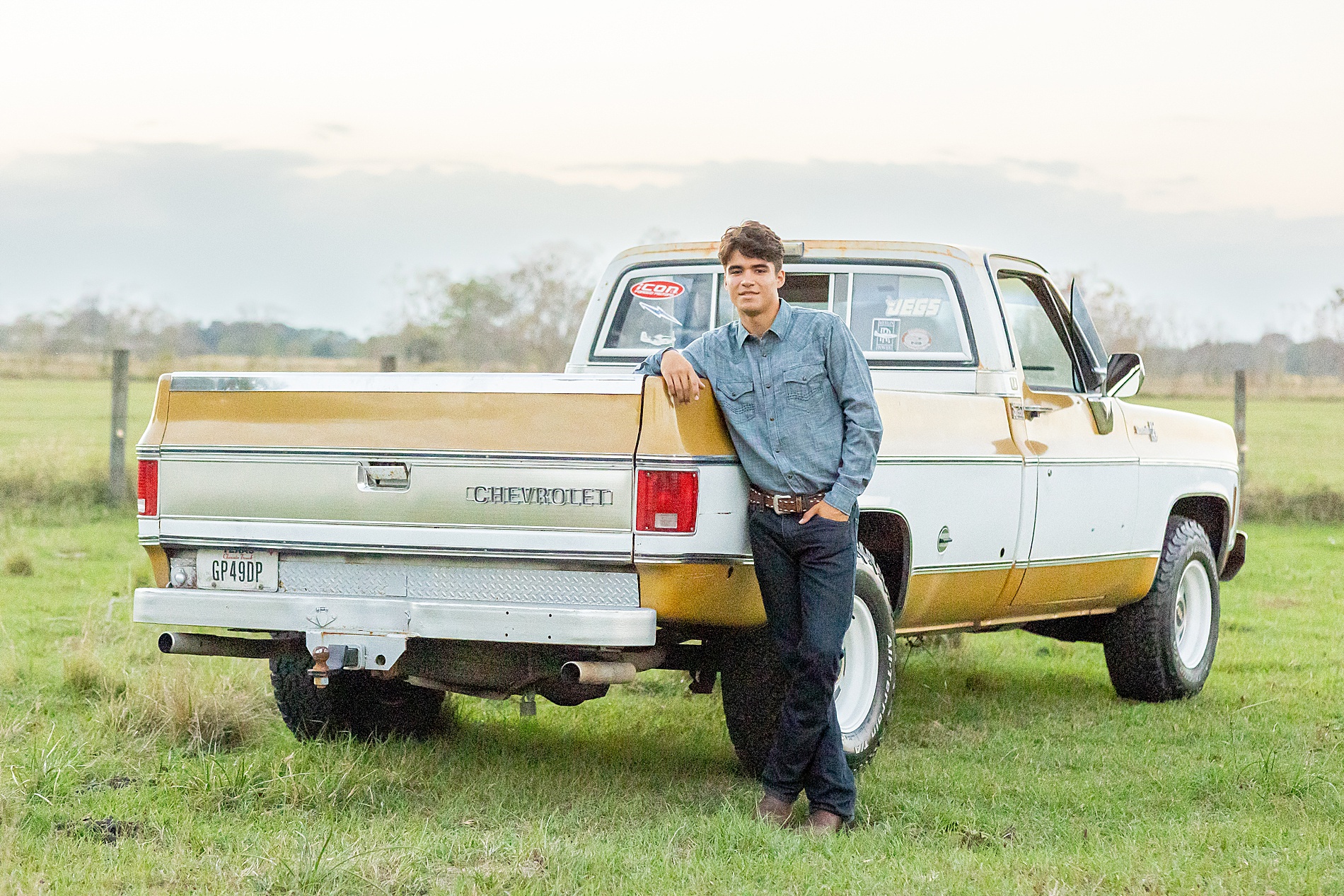 senior boy with his old truck 