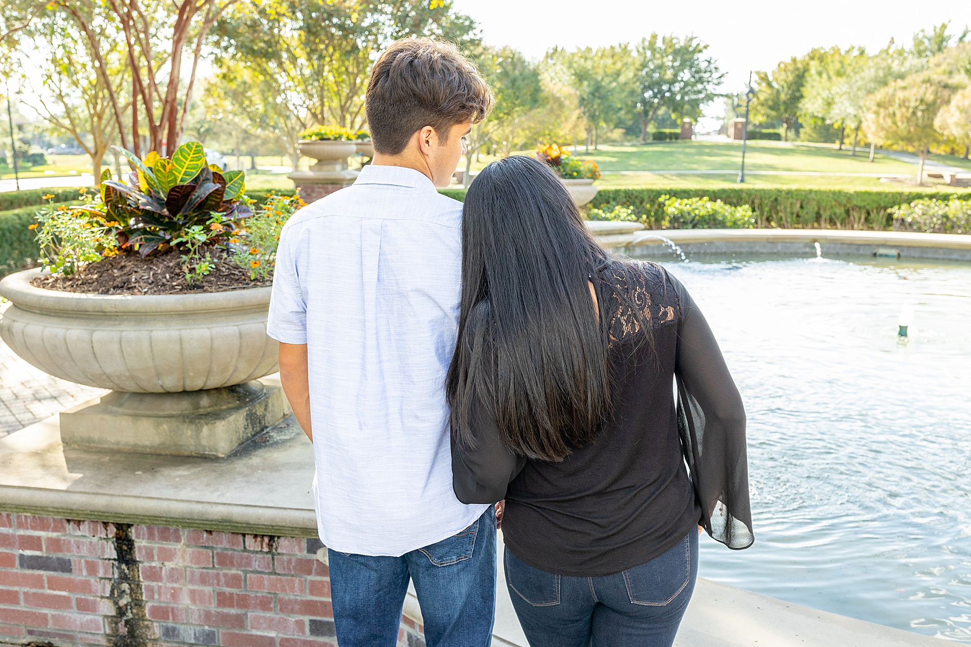 mother and son look at fountain 