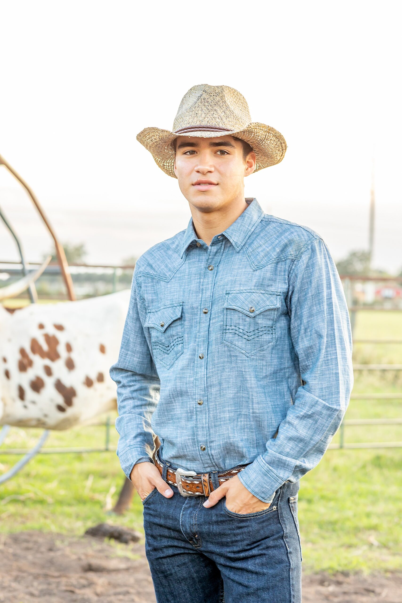 senior in cowboy hat during Houston Texas Senior Portraits