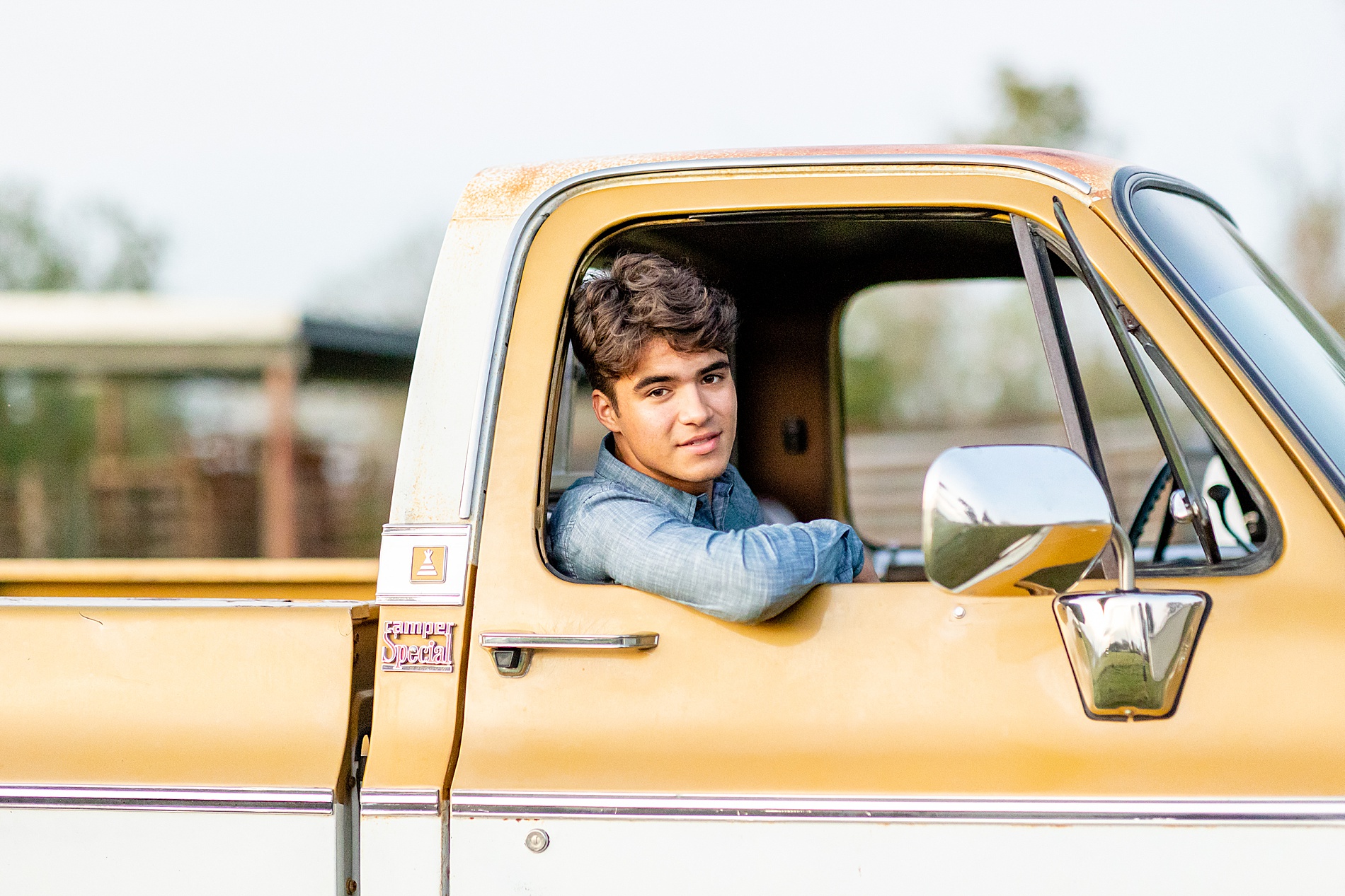 senior sits in his truck