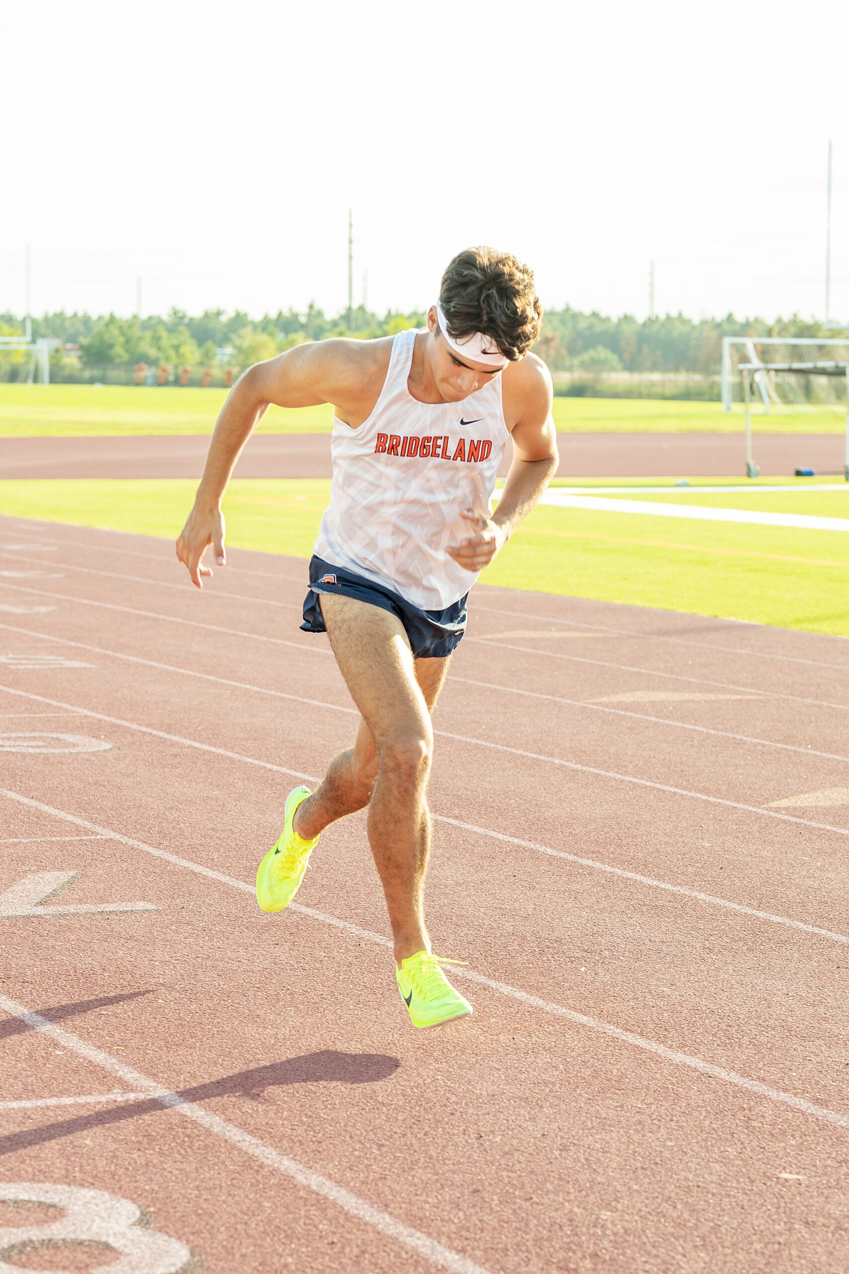 senior running at track 