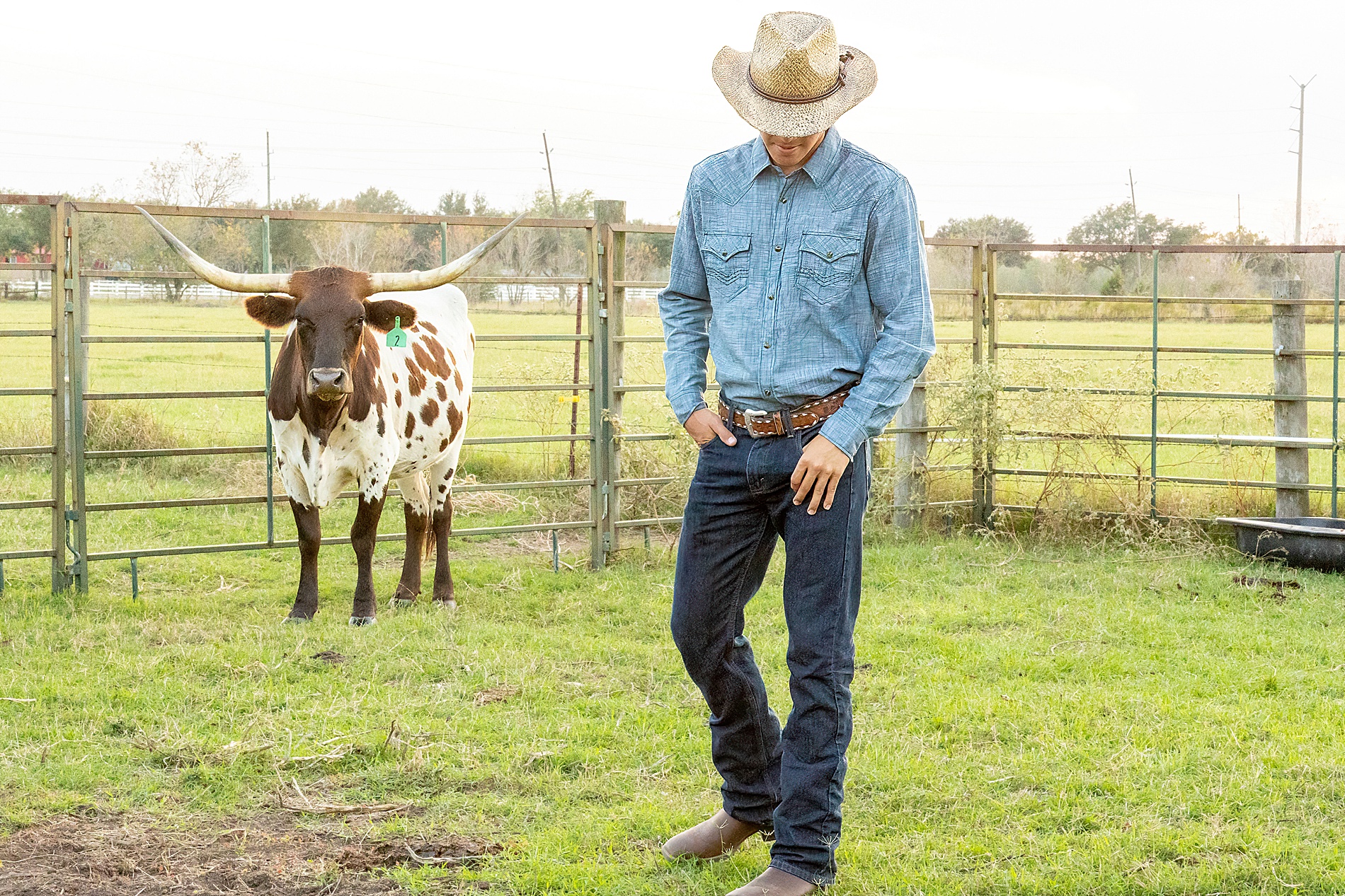 senior in cowboy hat with Longhorn