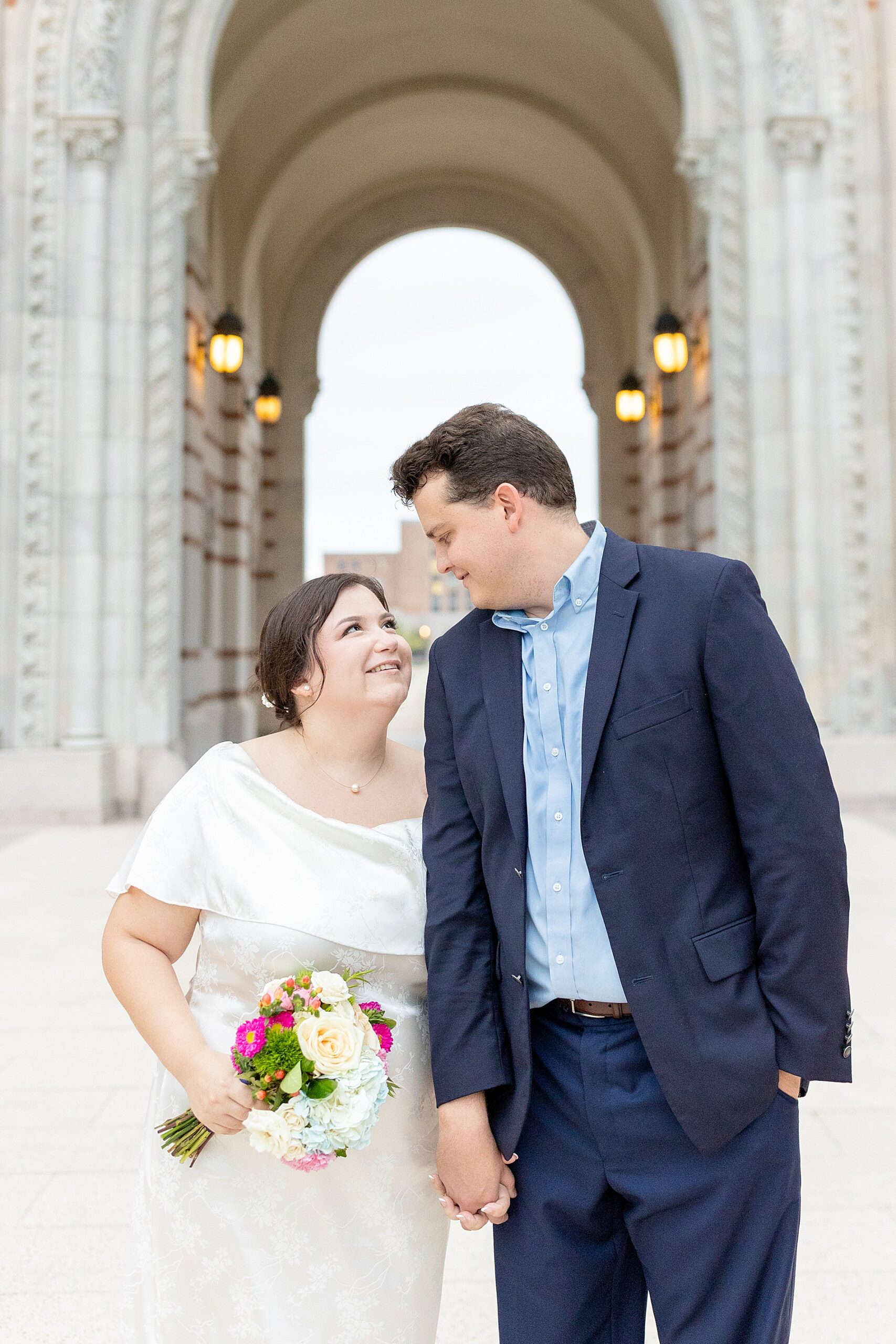 Romantic engagement photos in archway of Rice University in Houston