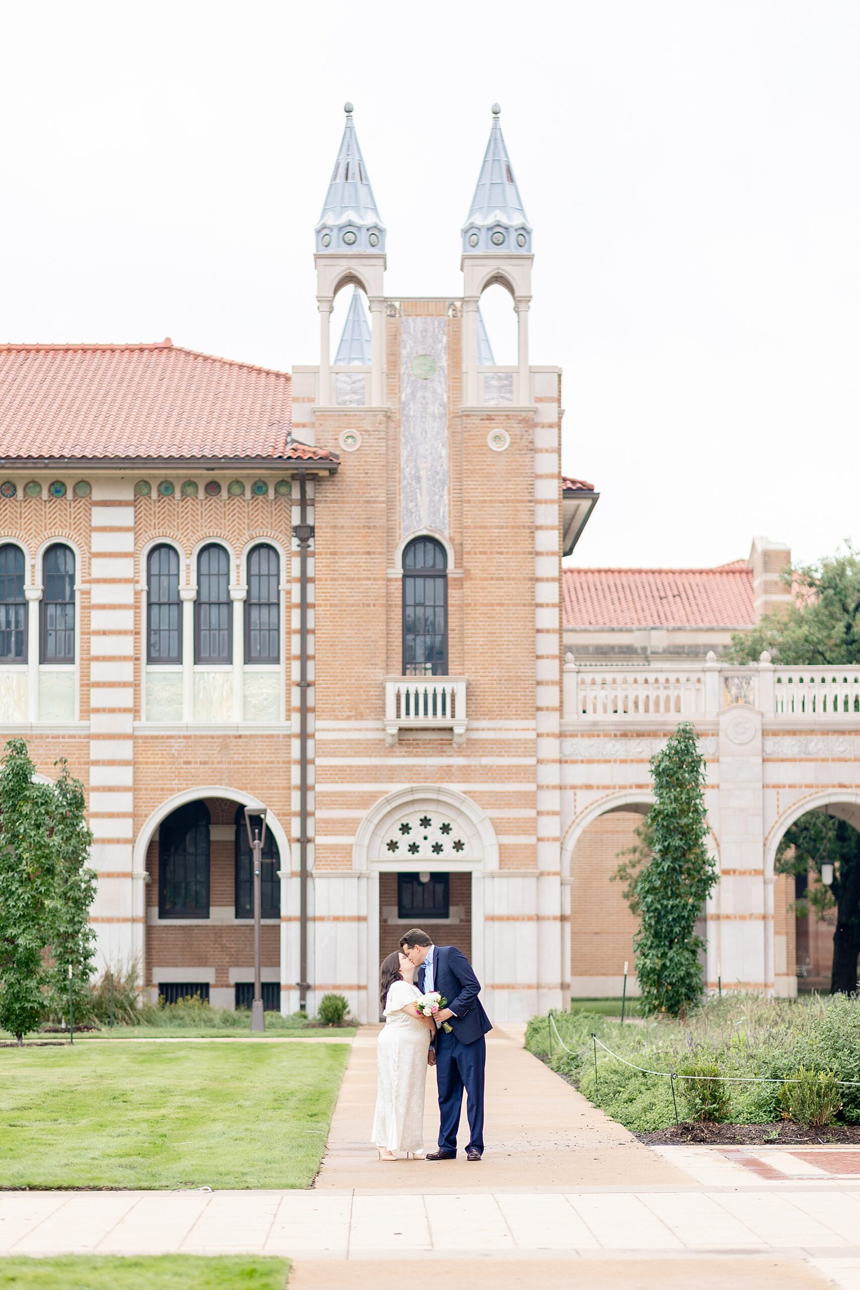 engaged couple outside of Rice University during engagement session