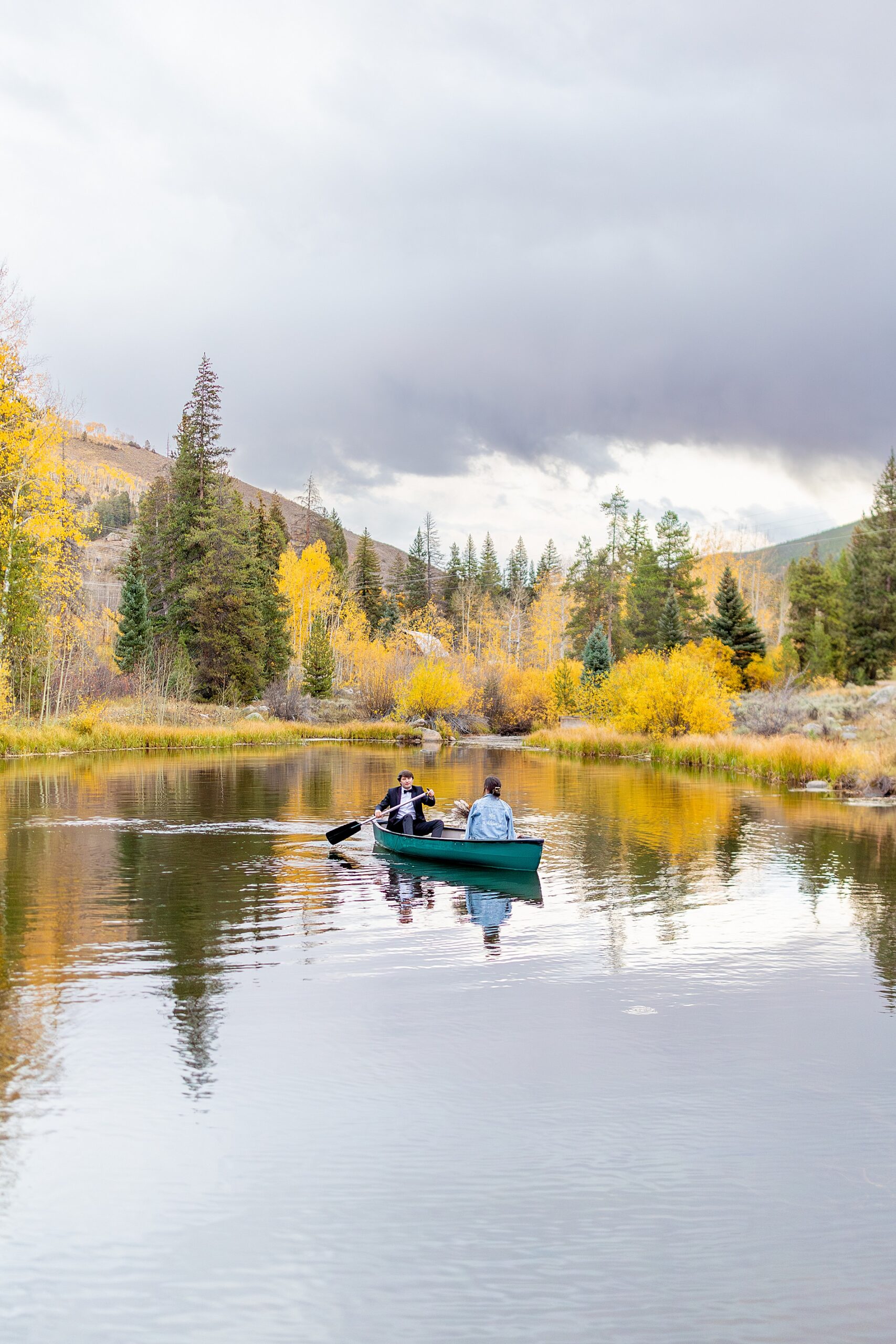 newlyweds go out on kayak in Aspen CO wedding