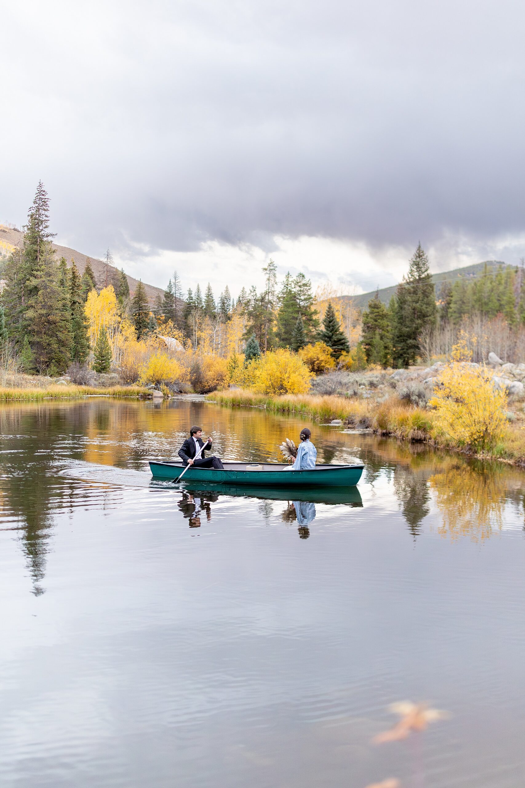 romantic fall wedding portraits of couple on kayal