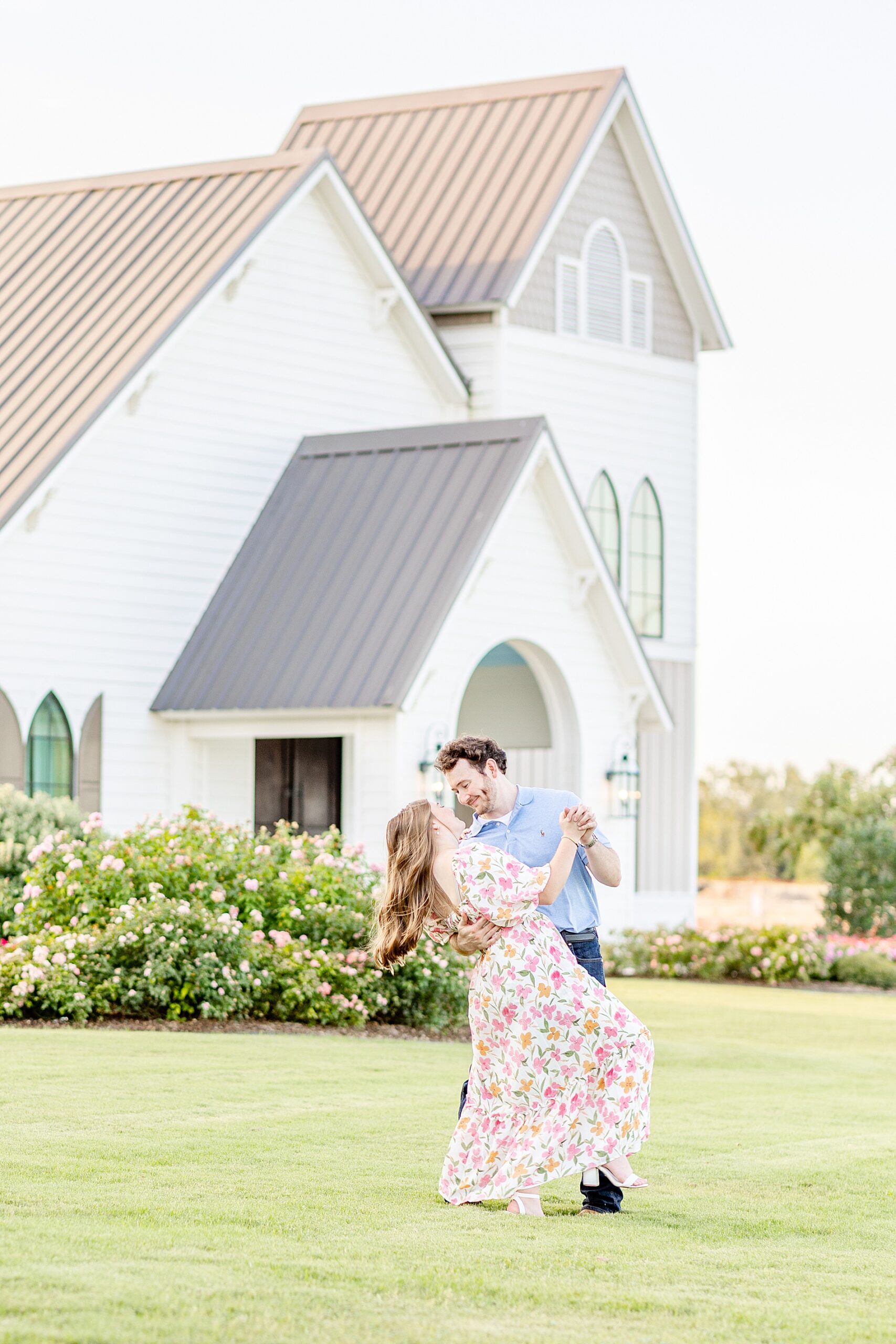 man dips his fiancé during Deep In The Heart Farms Engagement