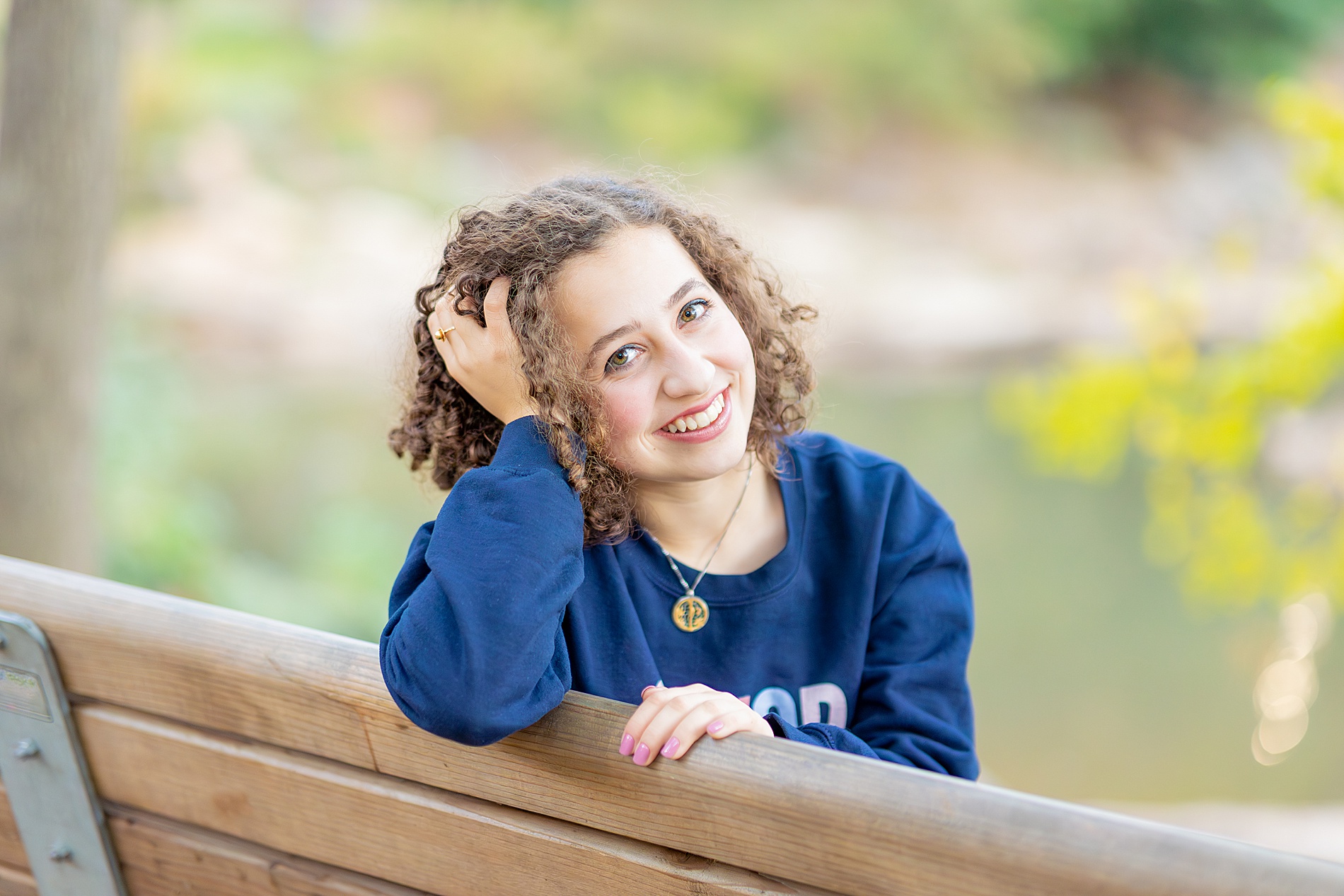 senior sits on bench