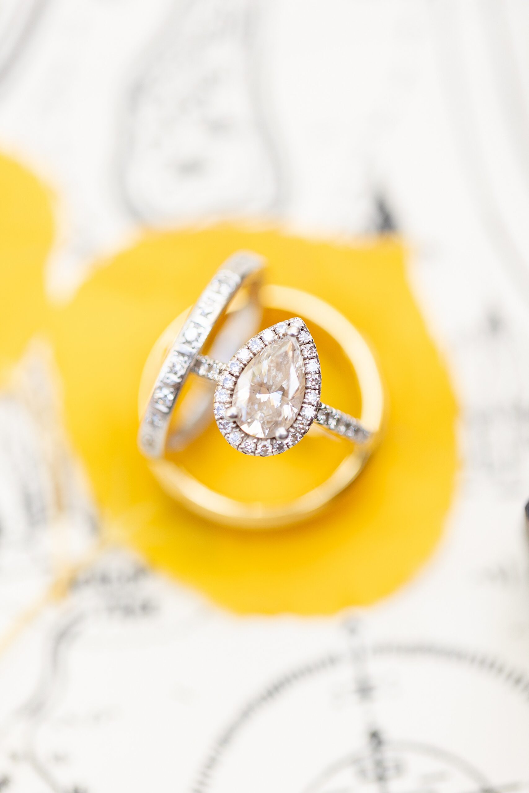 wedding rings on yellow leaf