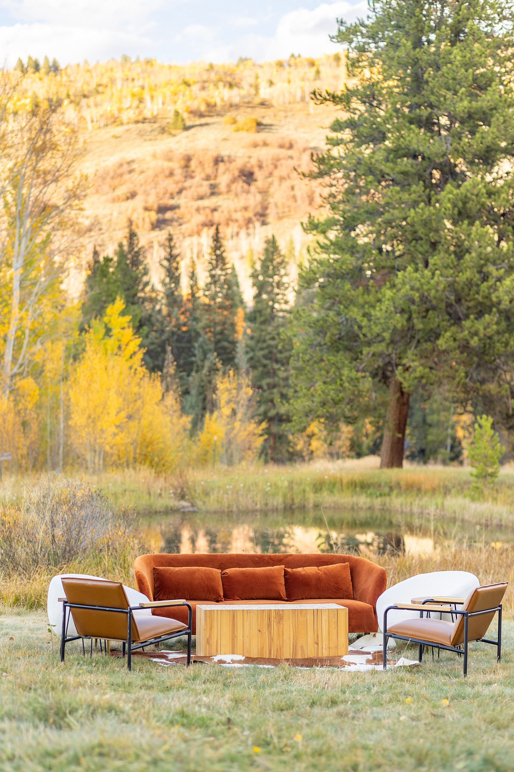 cozy lounge area by the water in Aspen, CO | Colorado Wedding at Beyul Retreat