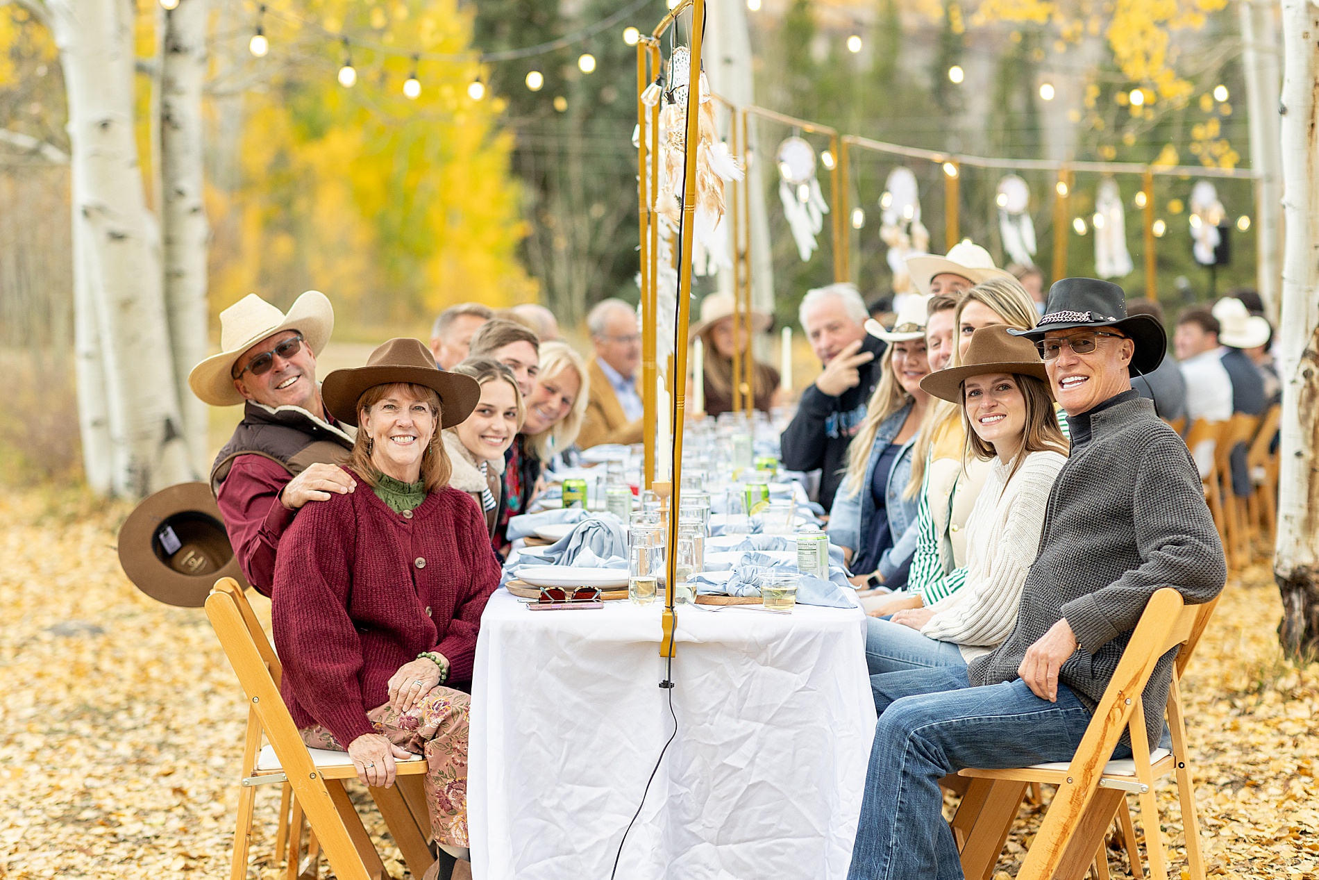 wedding guests at intimate dinner from Vibrant Aspen, Colorado Wedding at Beyul Retreat