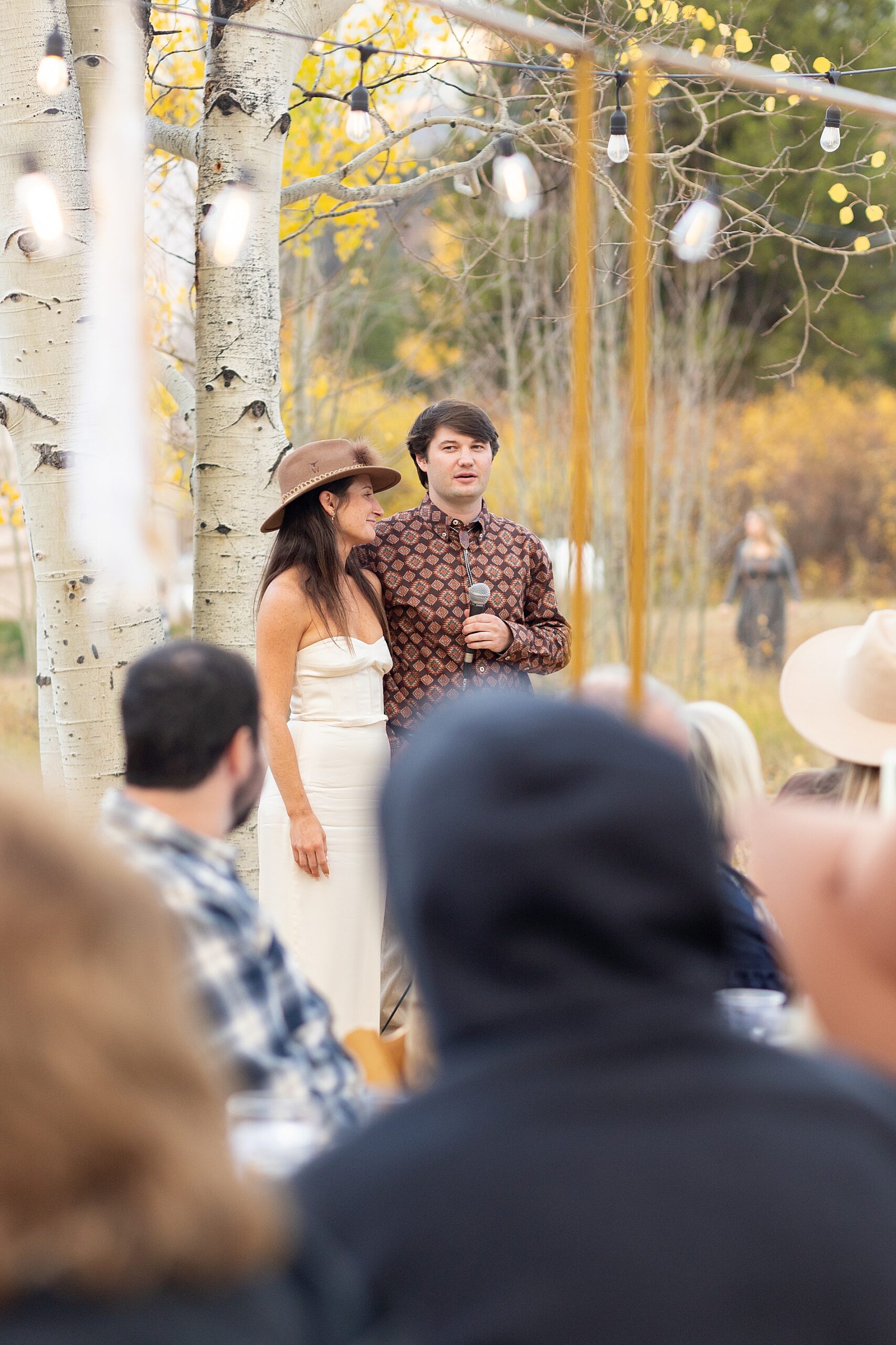 bride and groom to be give speech at welcome dinner