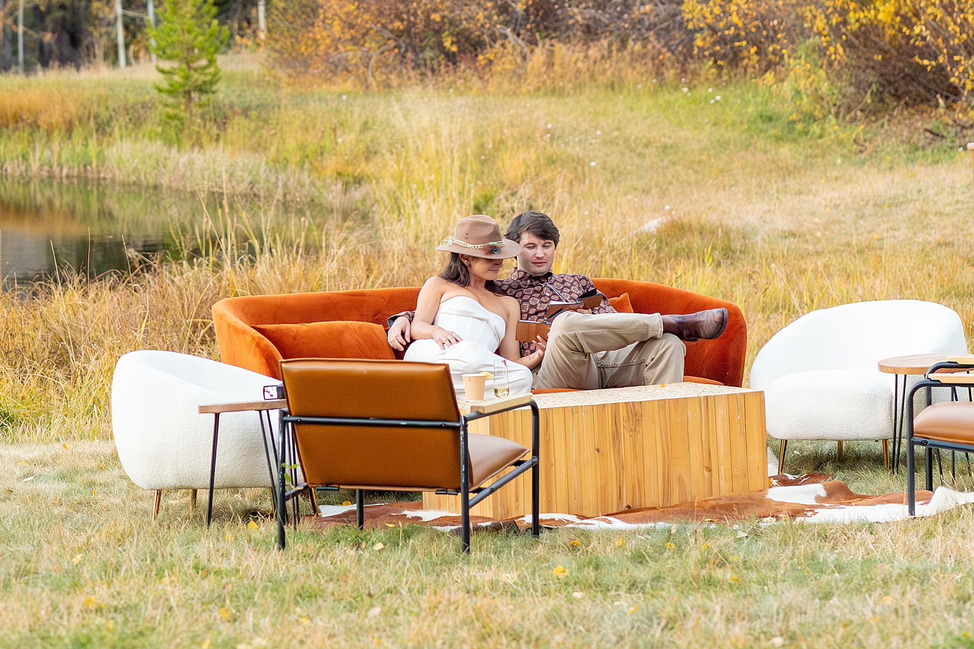 couple sit on outdoor lounge area