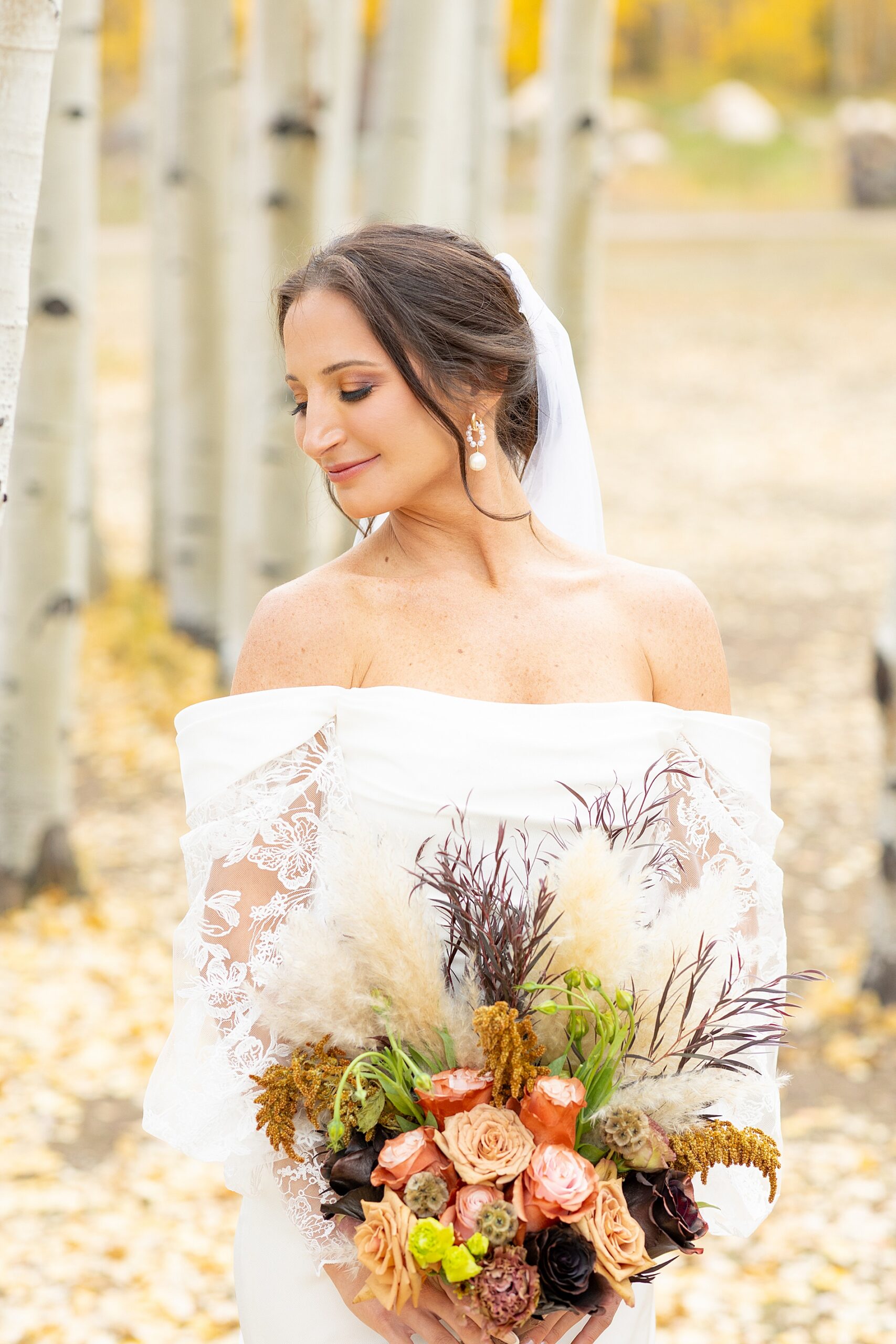 bride in wedding dress with bridal bouquet